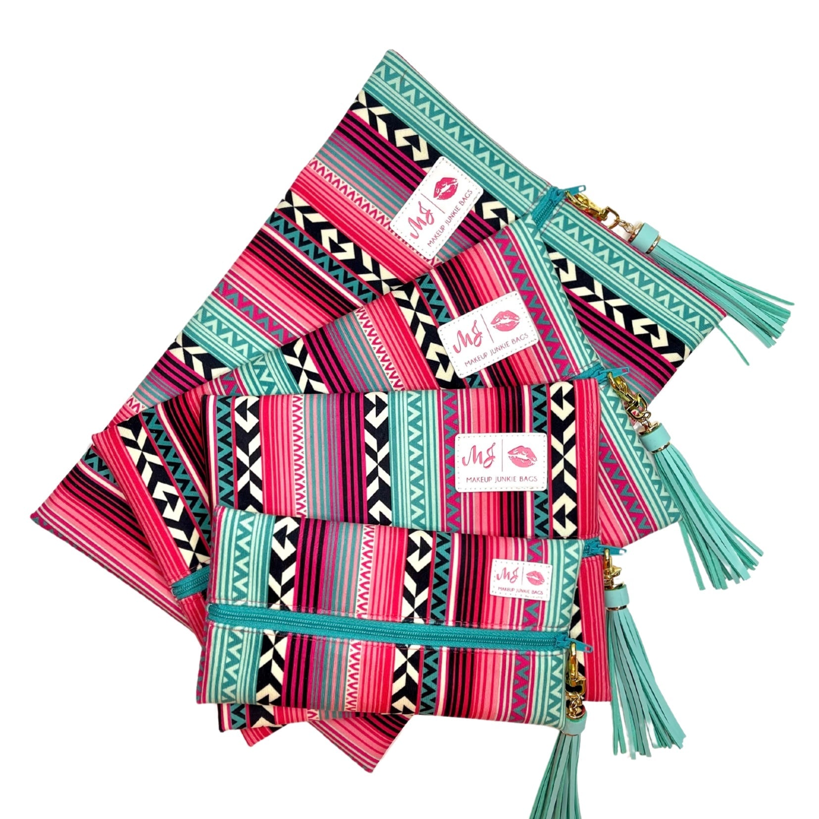 Set of colorful pouches with geometric patterns and tassels on a white background