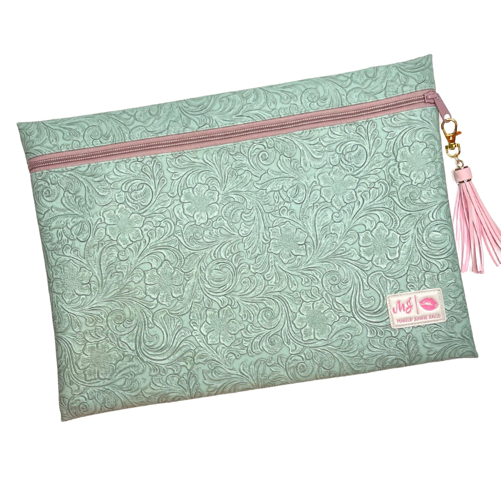 Mint green patterned pouch with pink zipper and tassel on a white background