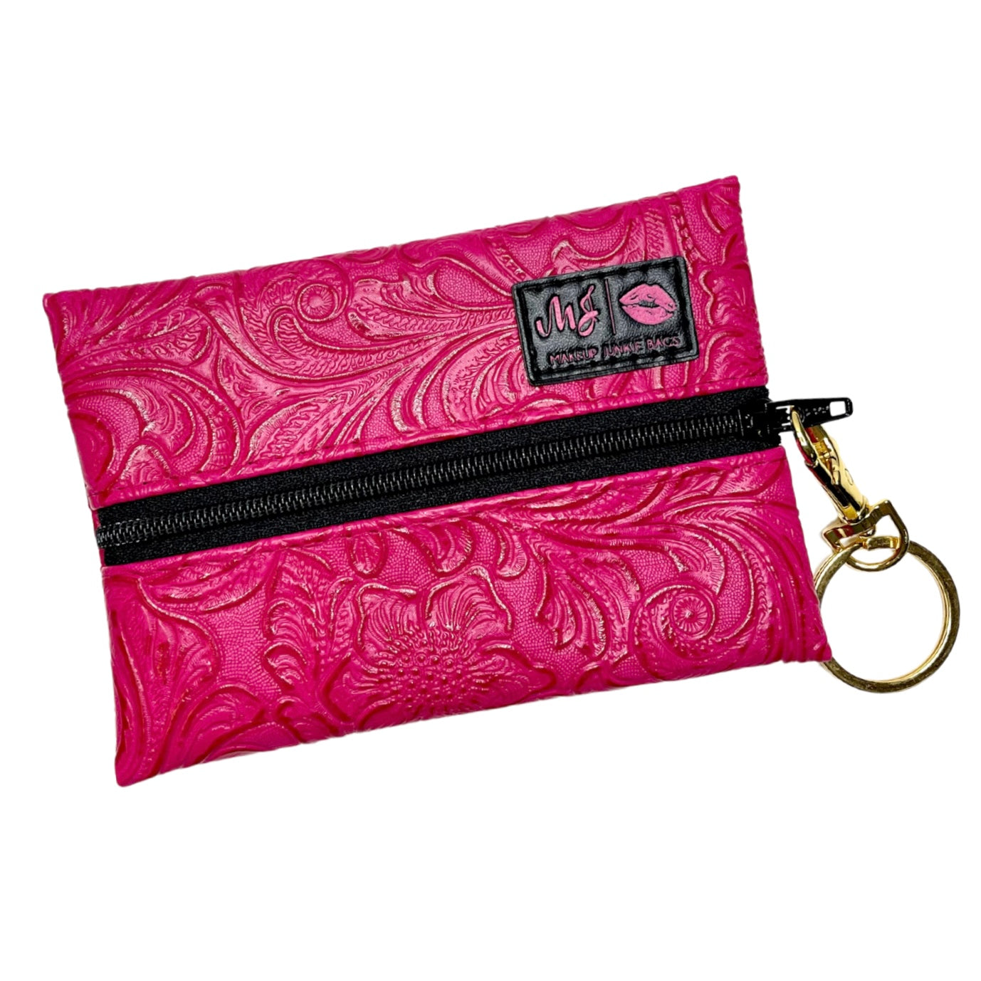 Pink embossed pouch with zipper and keychain on a white background