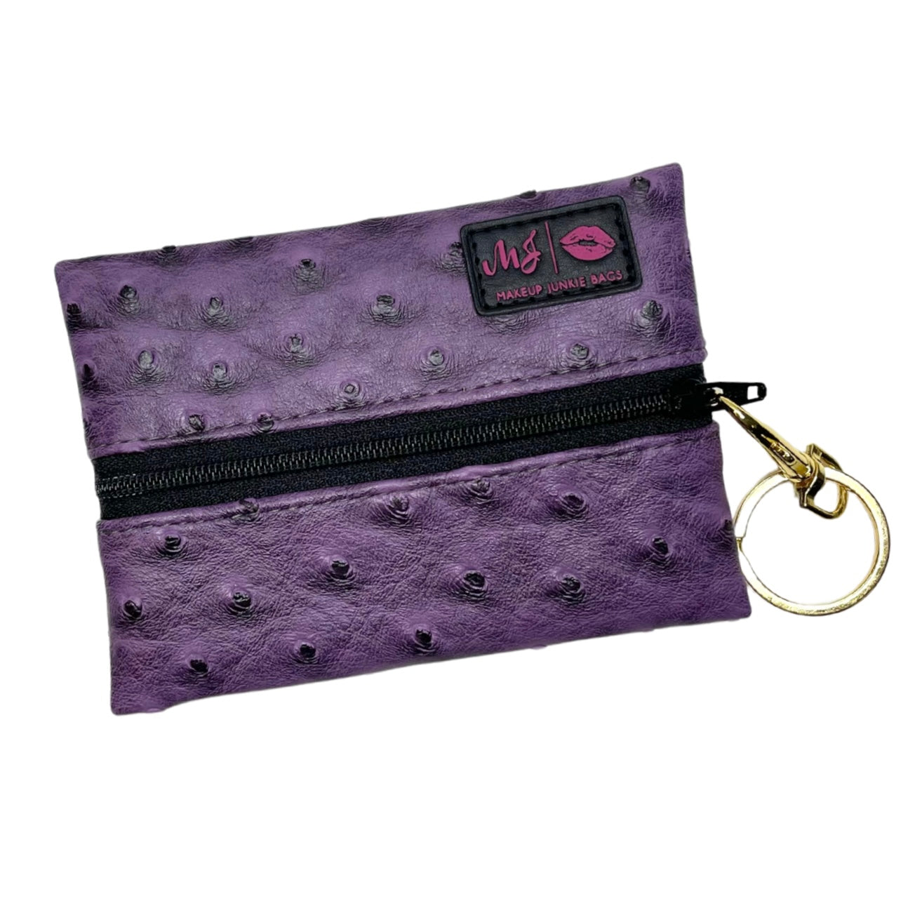 Purple textured pouch with a gold keychain on a white background