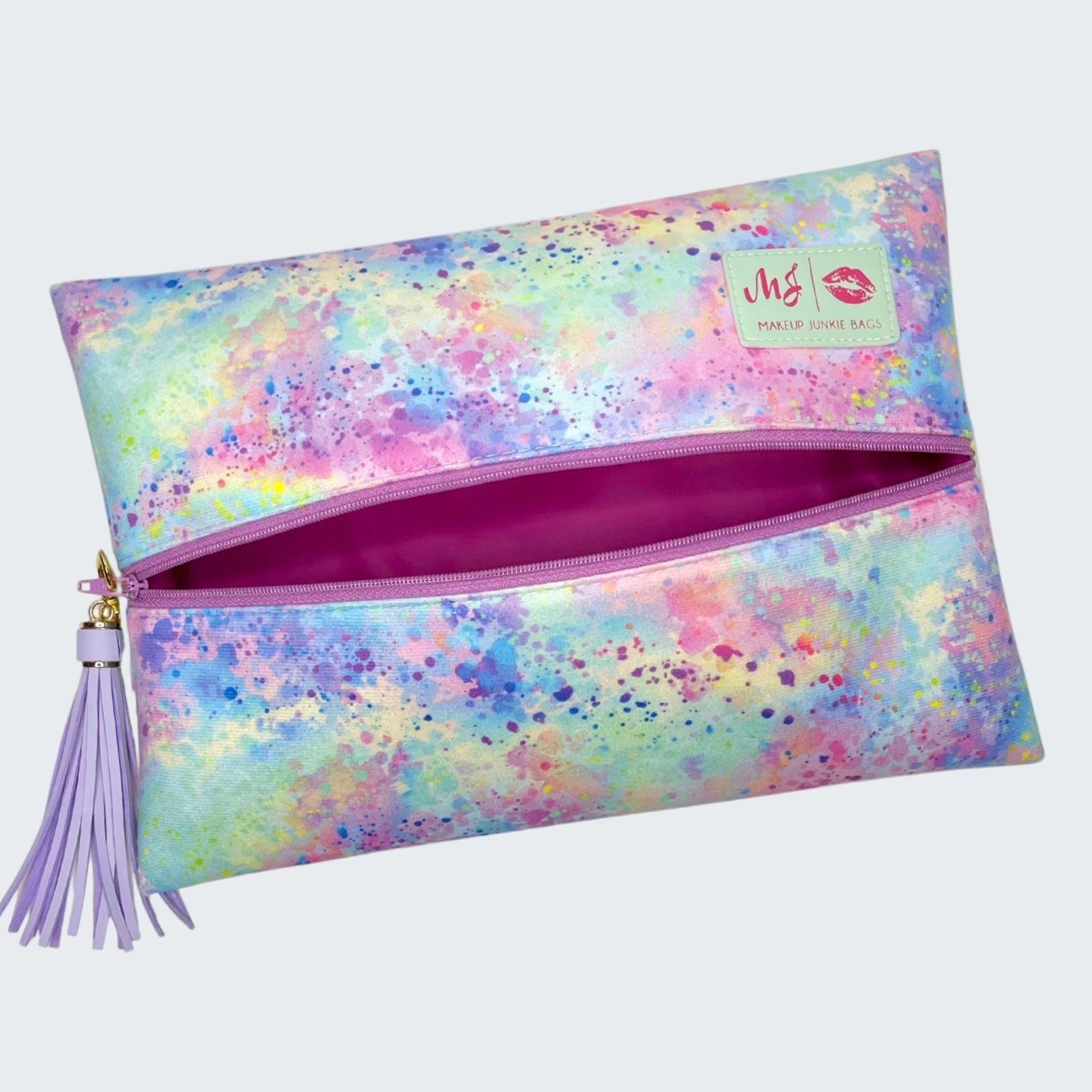 Colorful makeup bag with a tassel on a white background