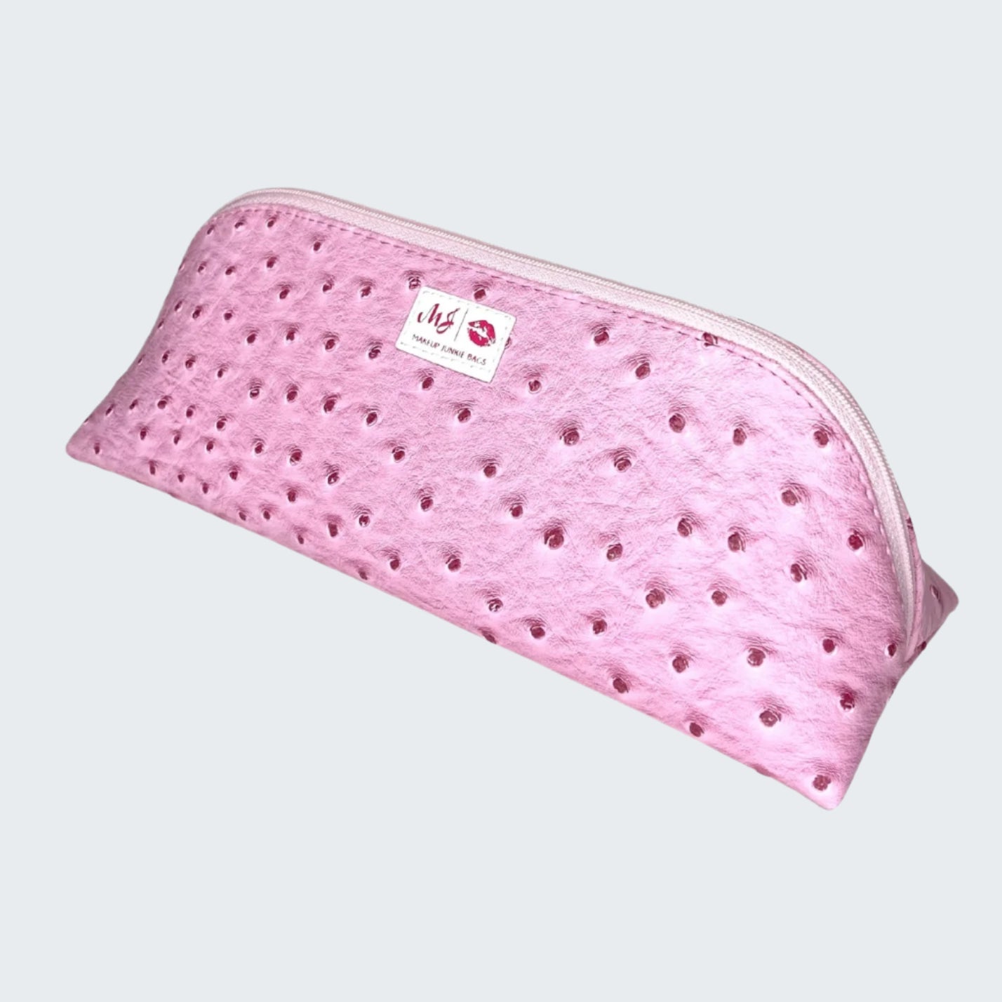 Pink pouch with a textured surface and visible brand label on a white background