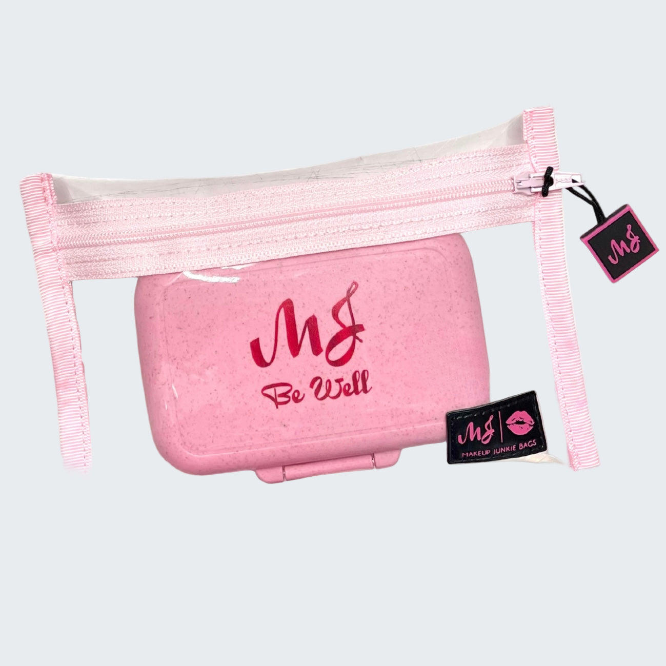 Pink pouch with 'MG Be Well' branding on a white background