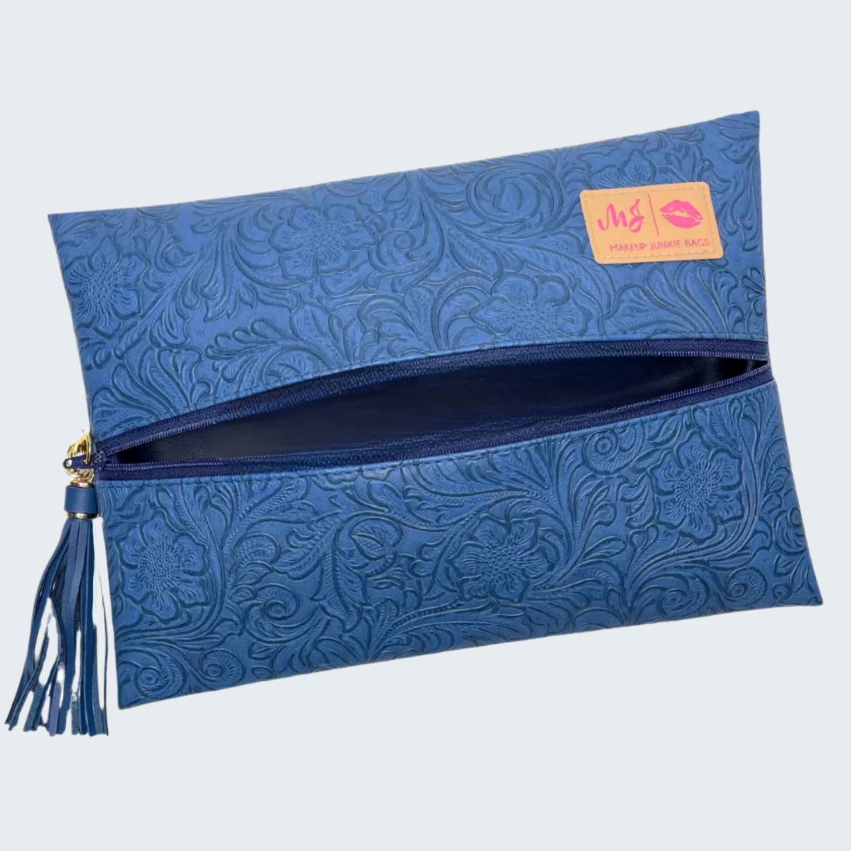 Blue embossed clutch bag with a visible brand label on a white background