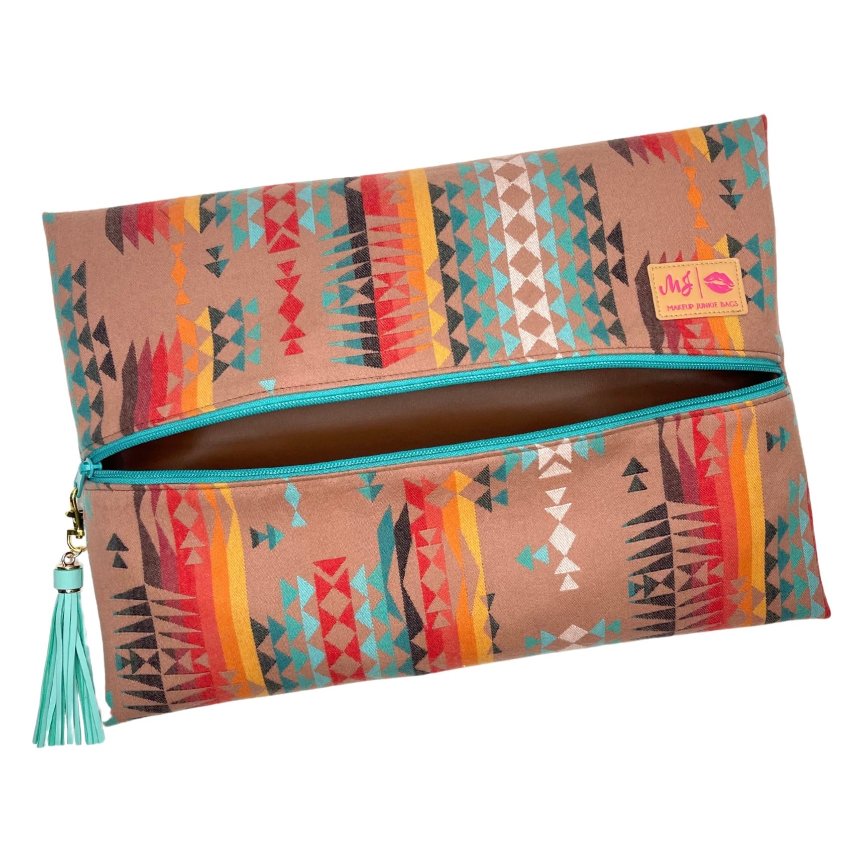 Colorful patterned clutch bag with a tassel on a white background