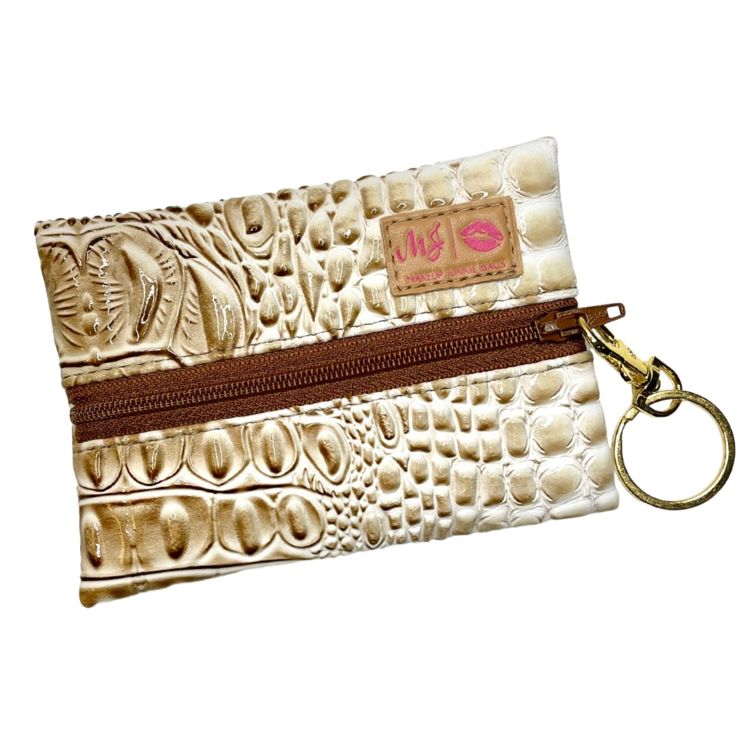 Beige textured pouch with brown zipper and keychain on a white background