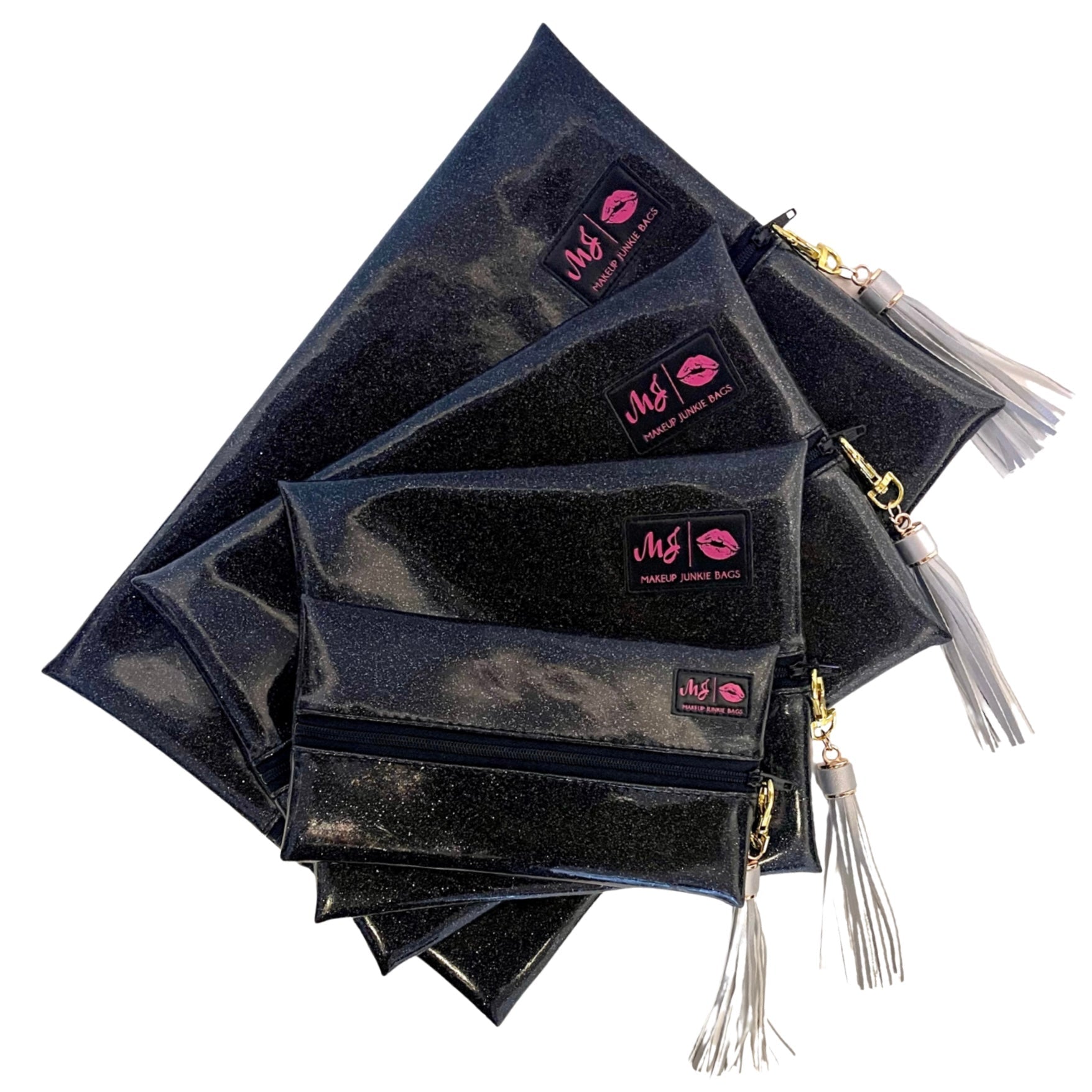 Stack of black makeup bags with visible brand logo on a white background