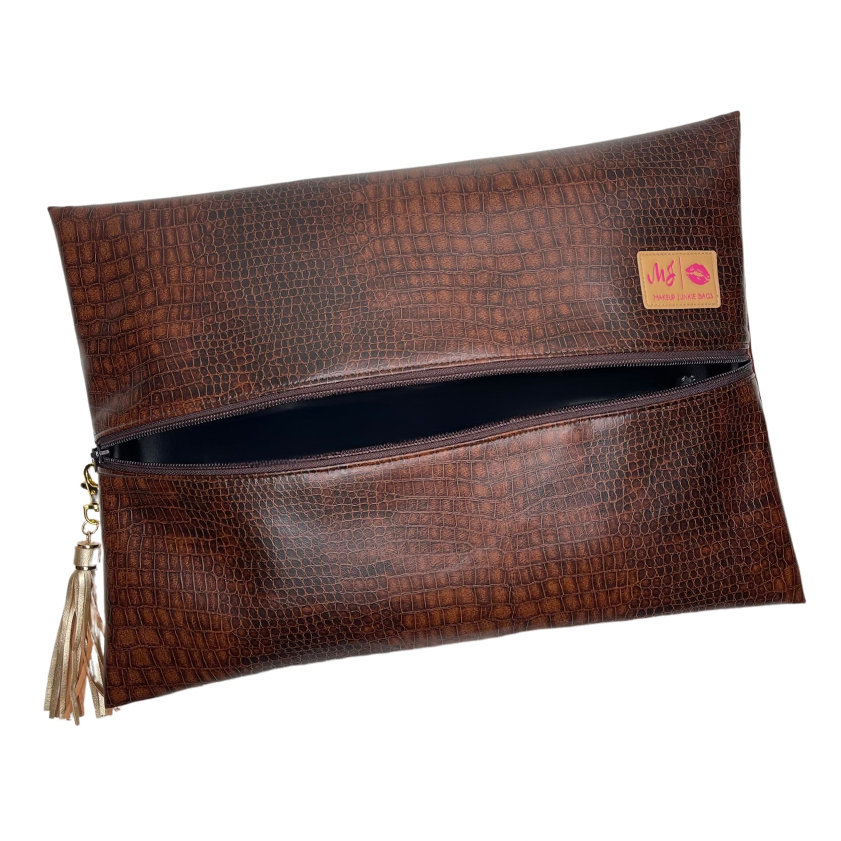 Brown textured clutch bag with a tassel on a white background