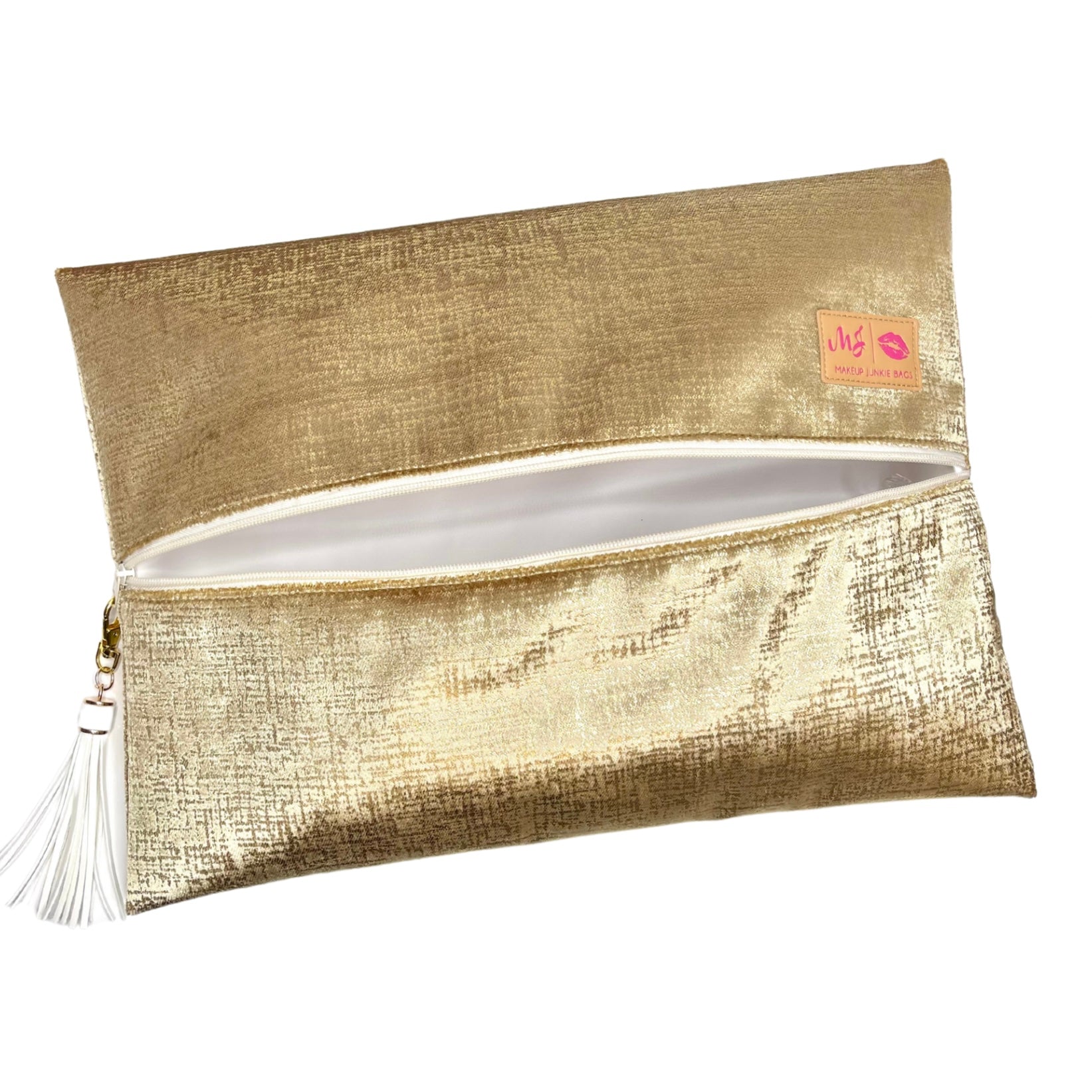 Gold clutch bag with tassel on a white background