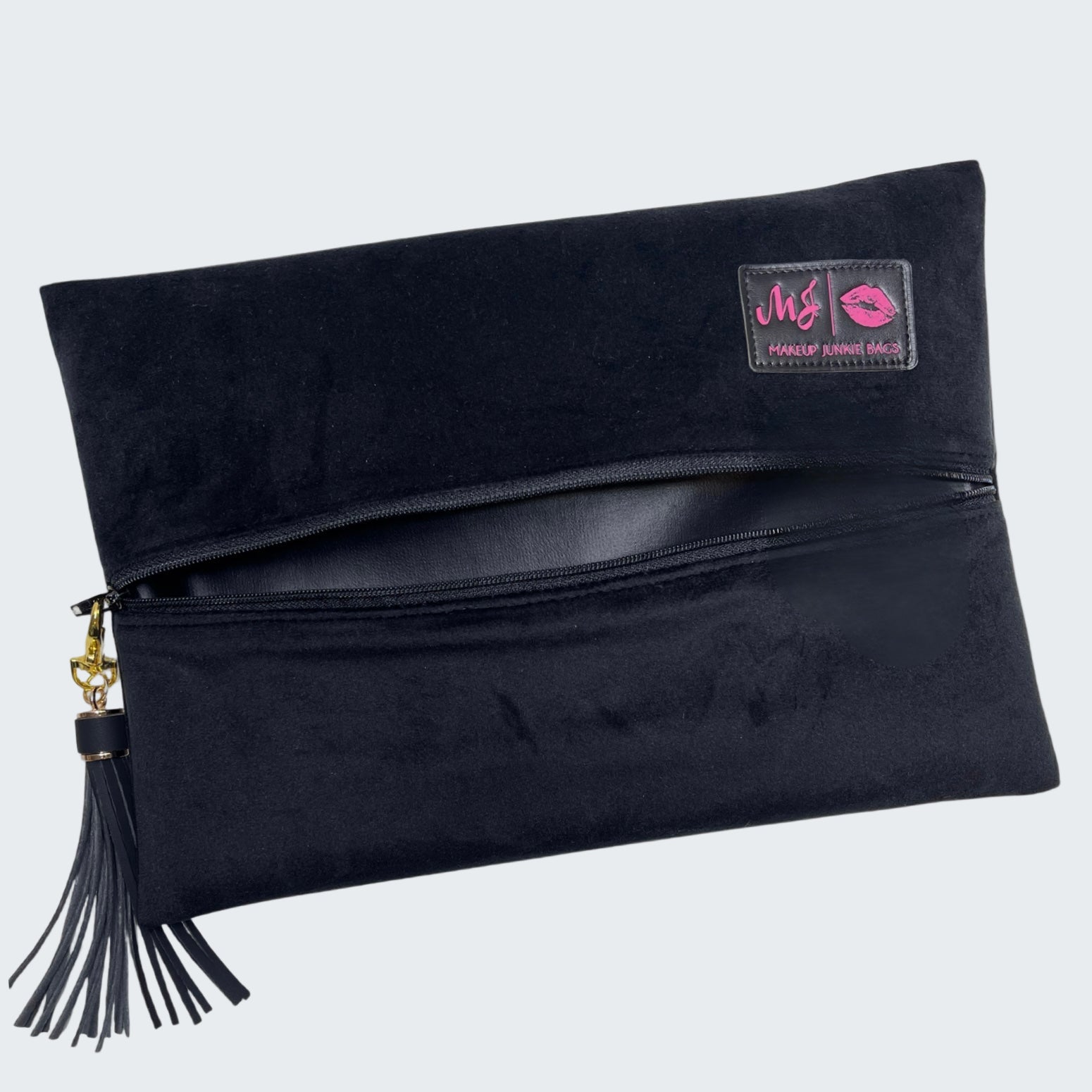 Black clutch bag with a tassel on a white background