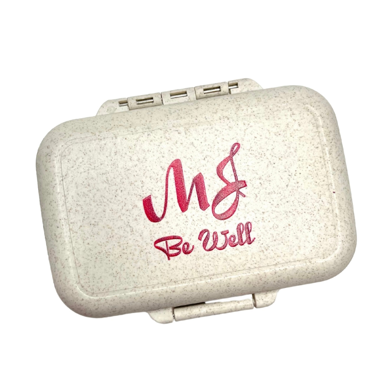 Small beige pill case with 'MJ Be Well' text on a white background