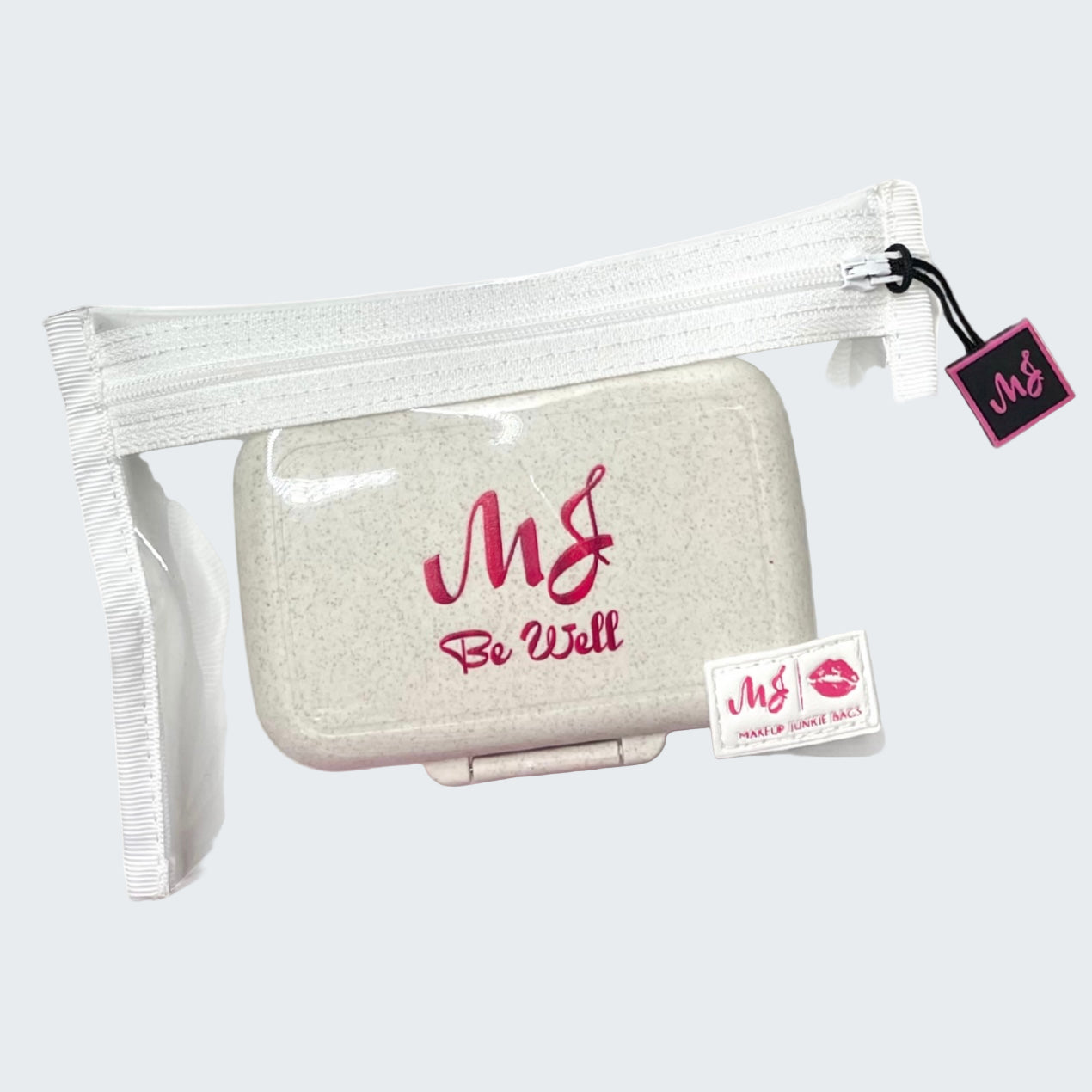 Small beige pouch with 'MG' branding in a clear plastic bag on a white background