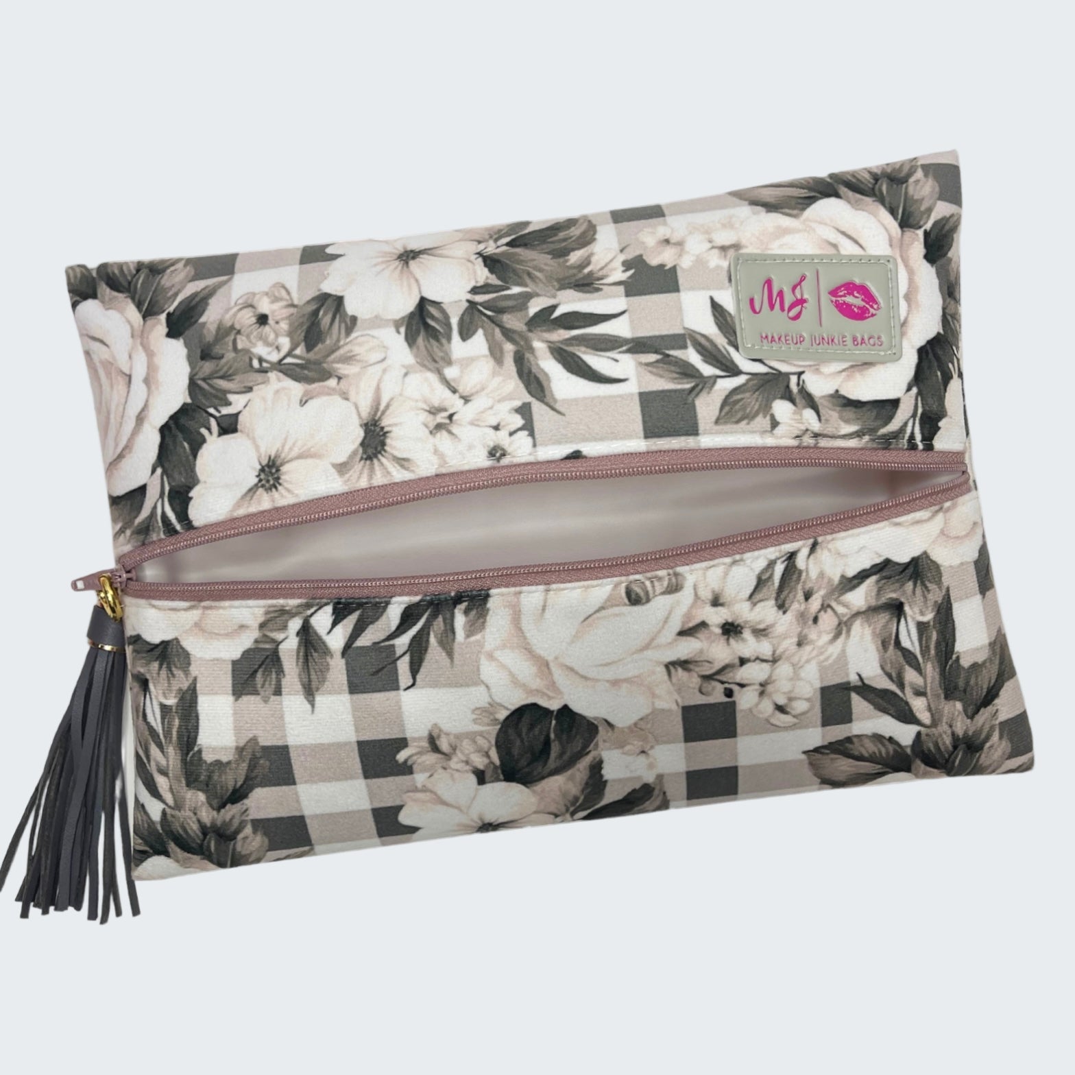 Floral and checkered patterned makeup bag with a visible brand label on a white background
