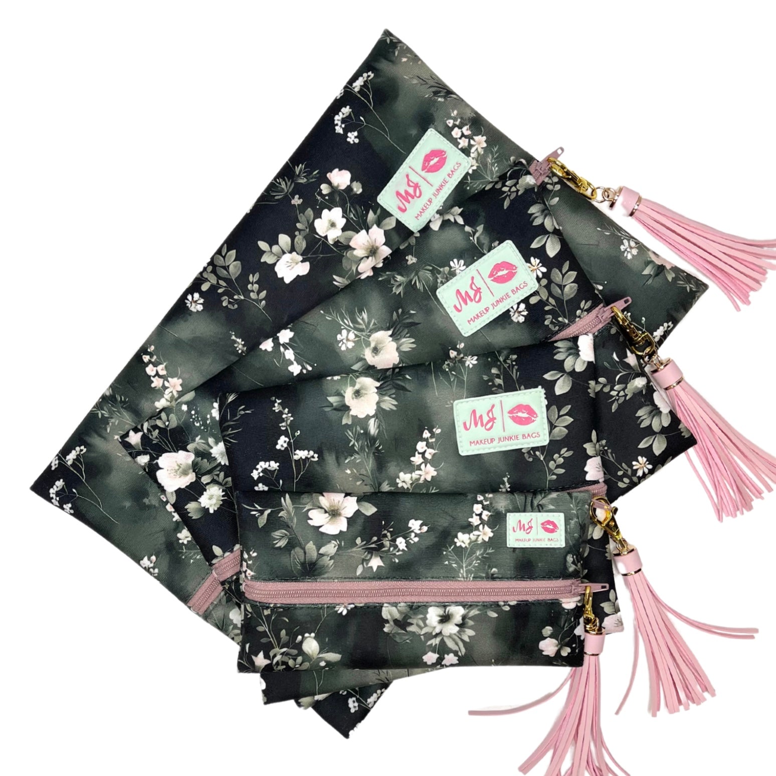 Set of floral pouches with pink tassels and visible brand labels on a white background