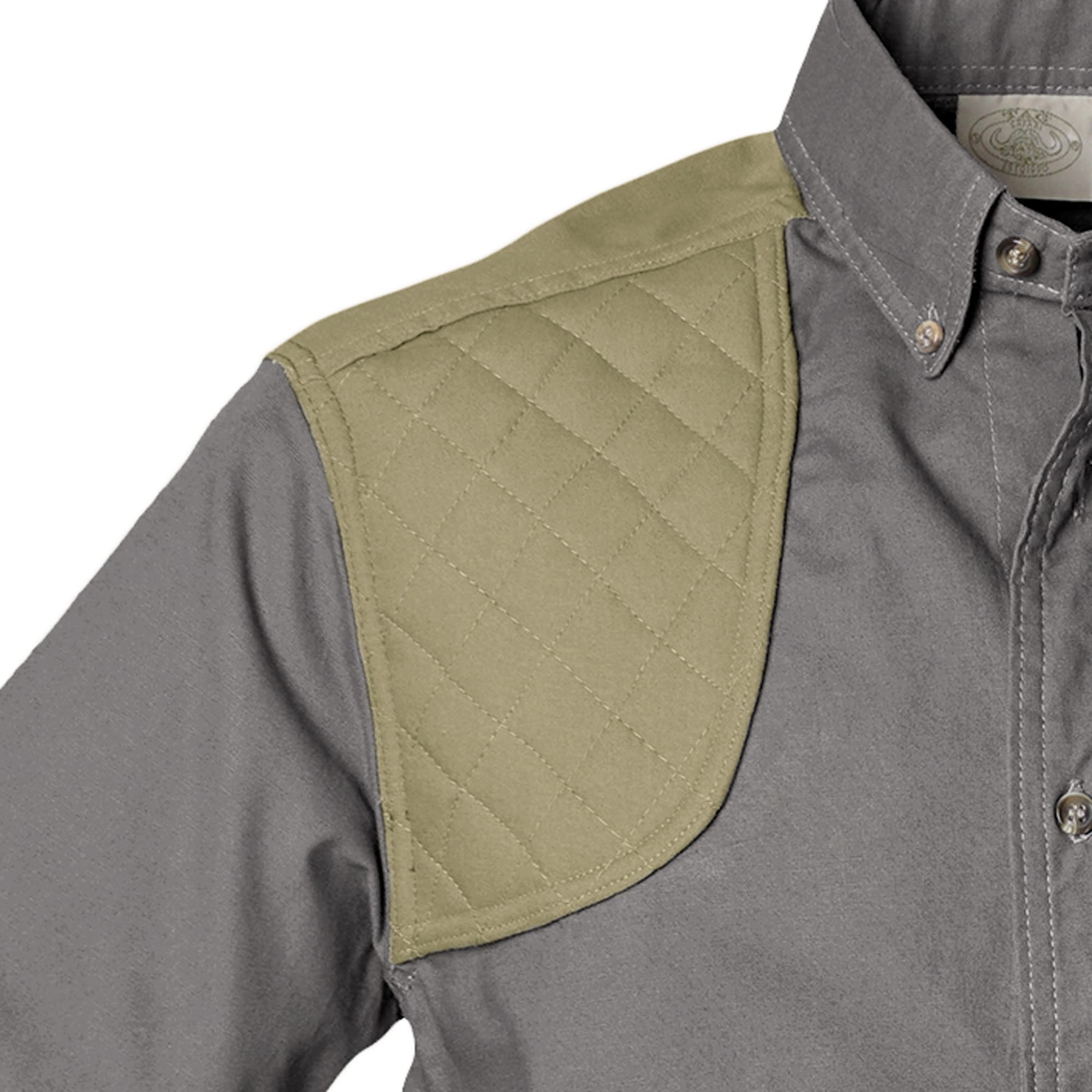 Gray shirt with green quilted shoulder panel on a white background
