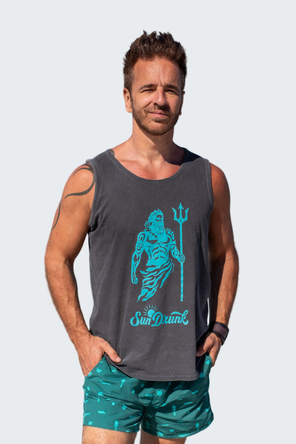 Man wearing a tank top with a graphic design on a beach
