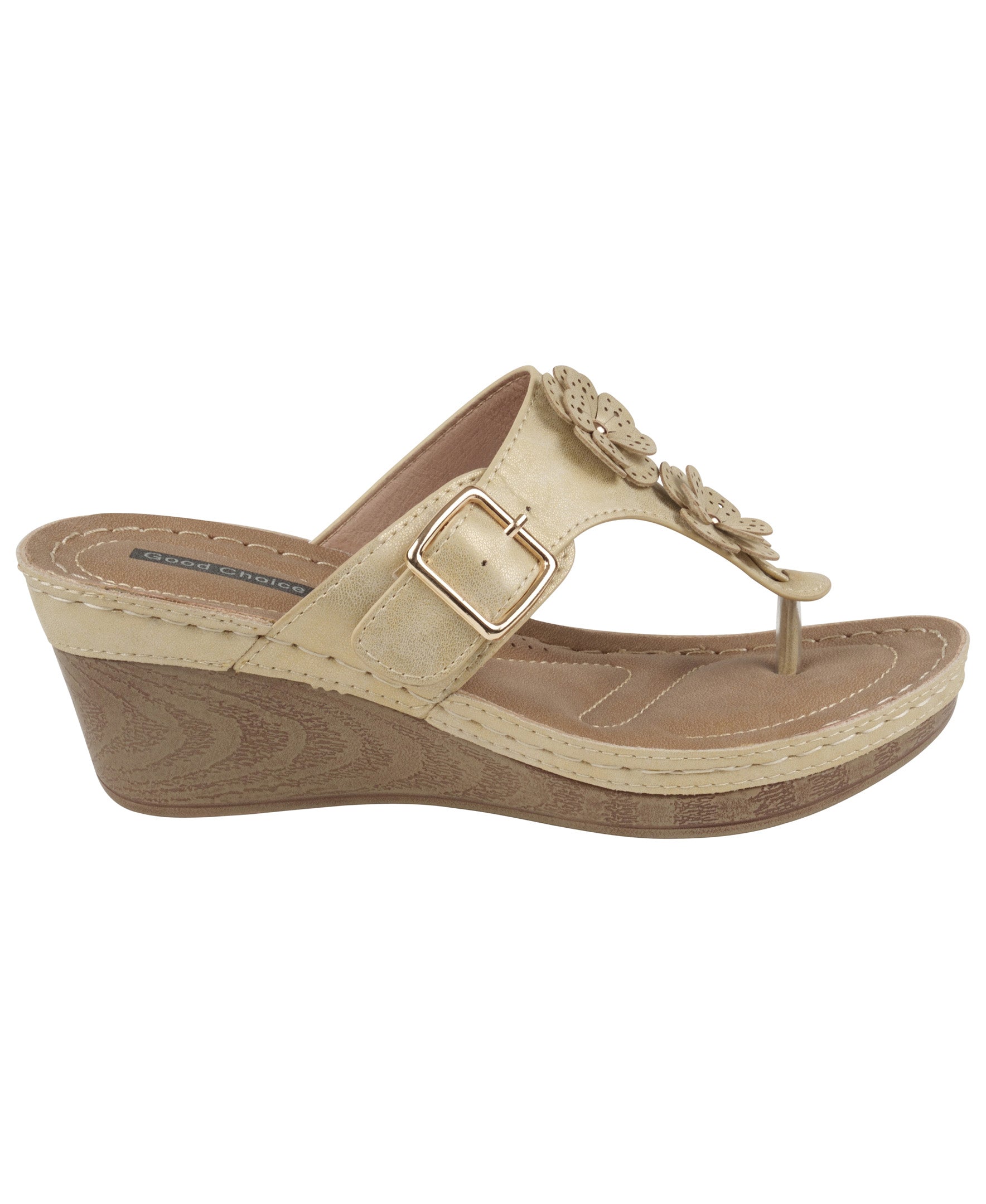 Beige wedge sandal with a floral design on a white background