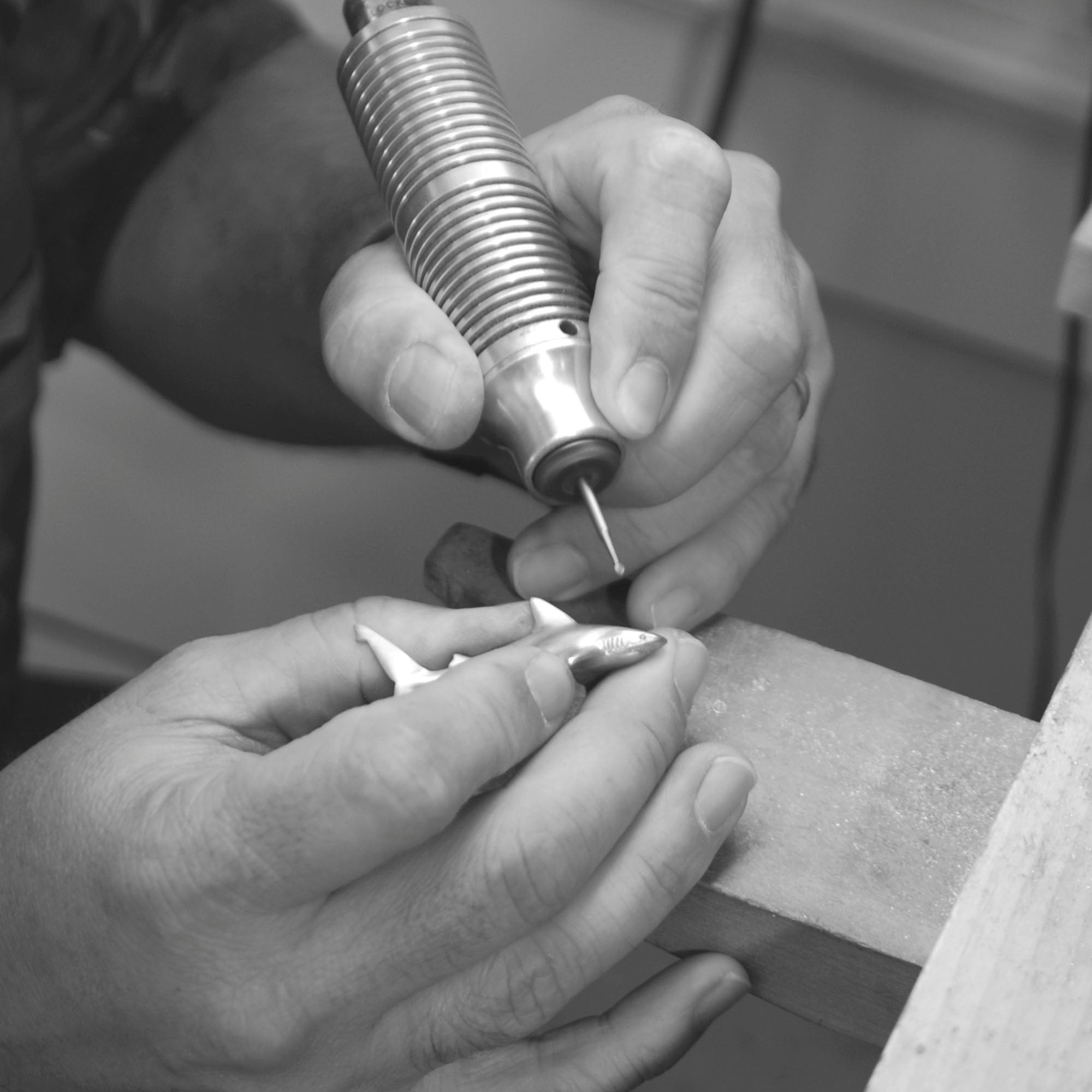 Person using a dental drill on a tooth