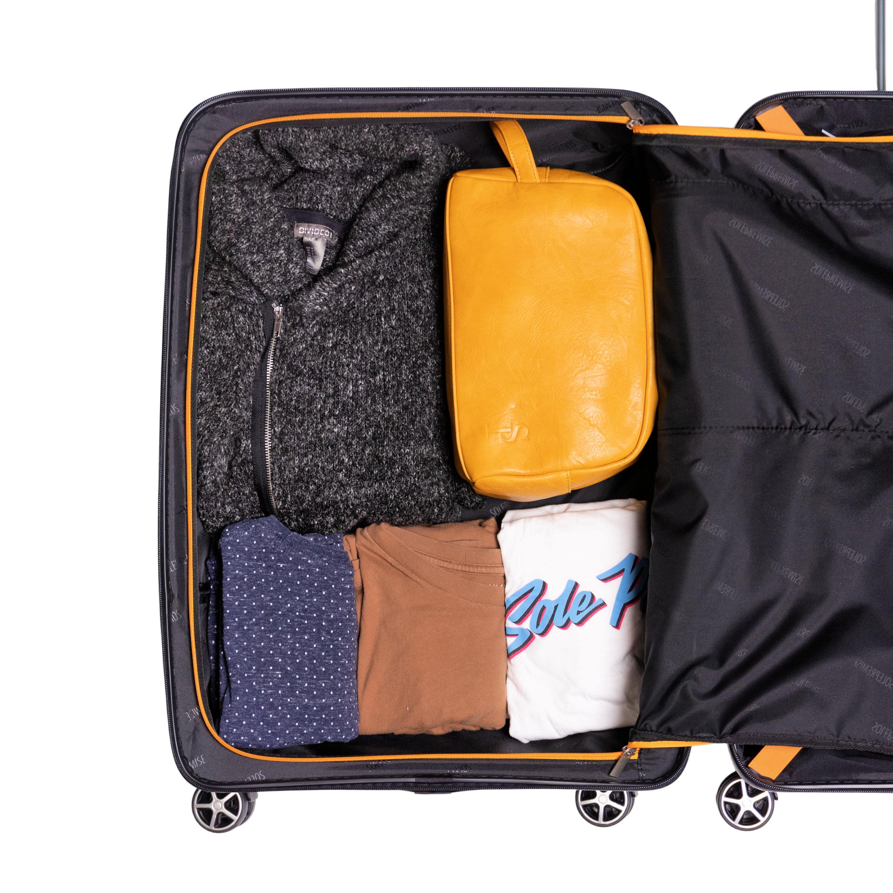 Open suitcase with clothes and a yellow pouch inside