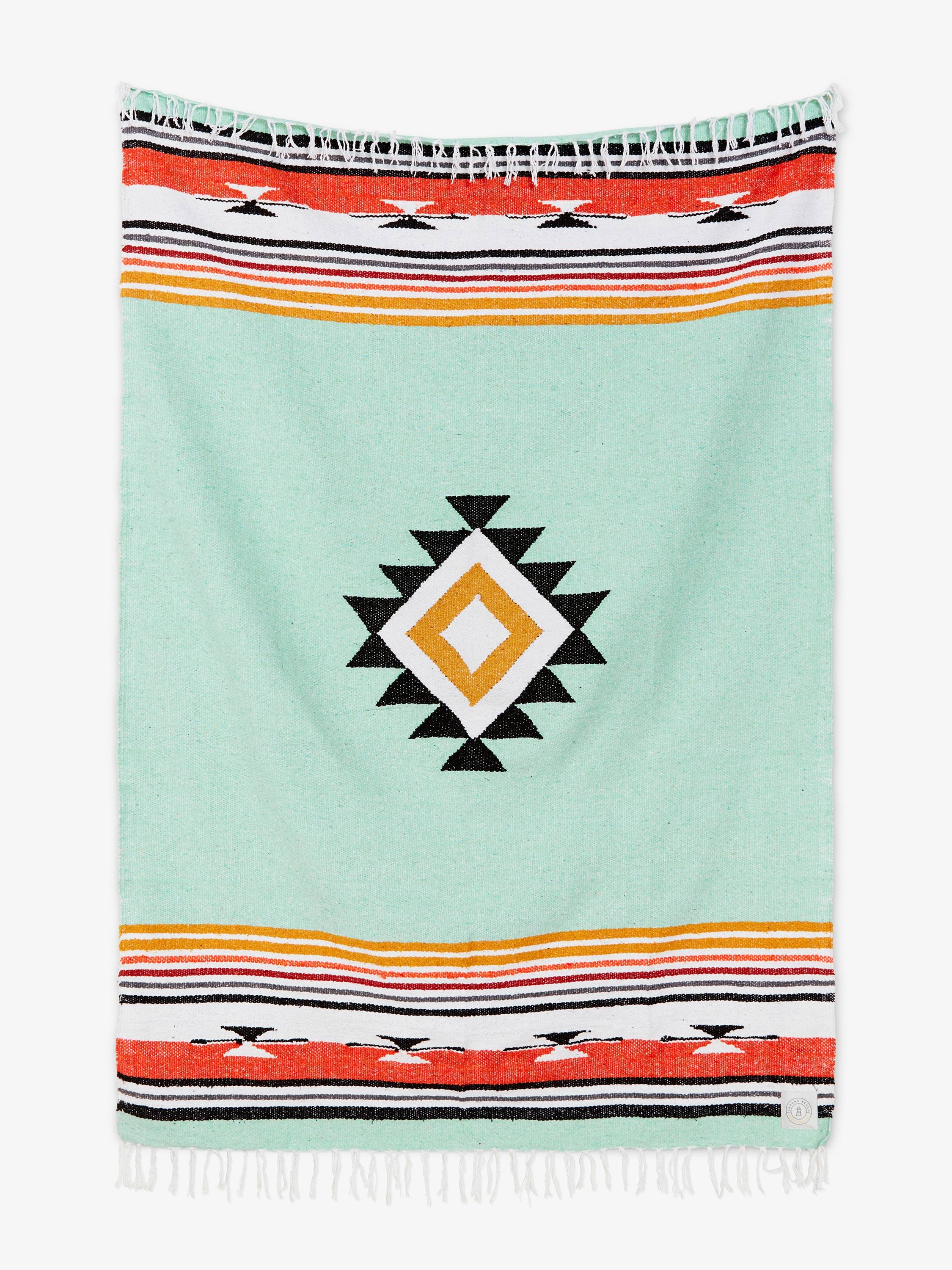 Colorful towel with geometric pattern on a light blue background