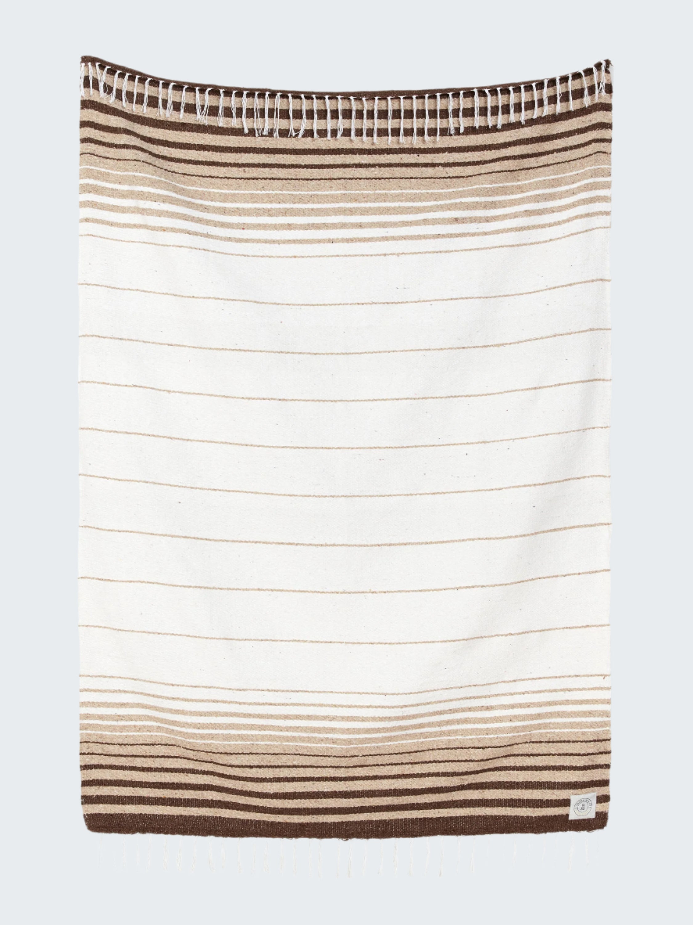 Striped towel with brown and beige colors on a white background