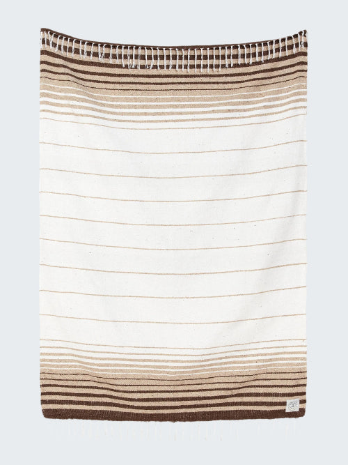 Striped towel with brown and beige colors on a white background