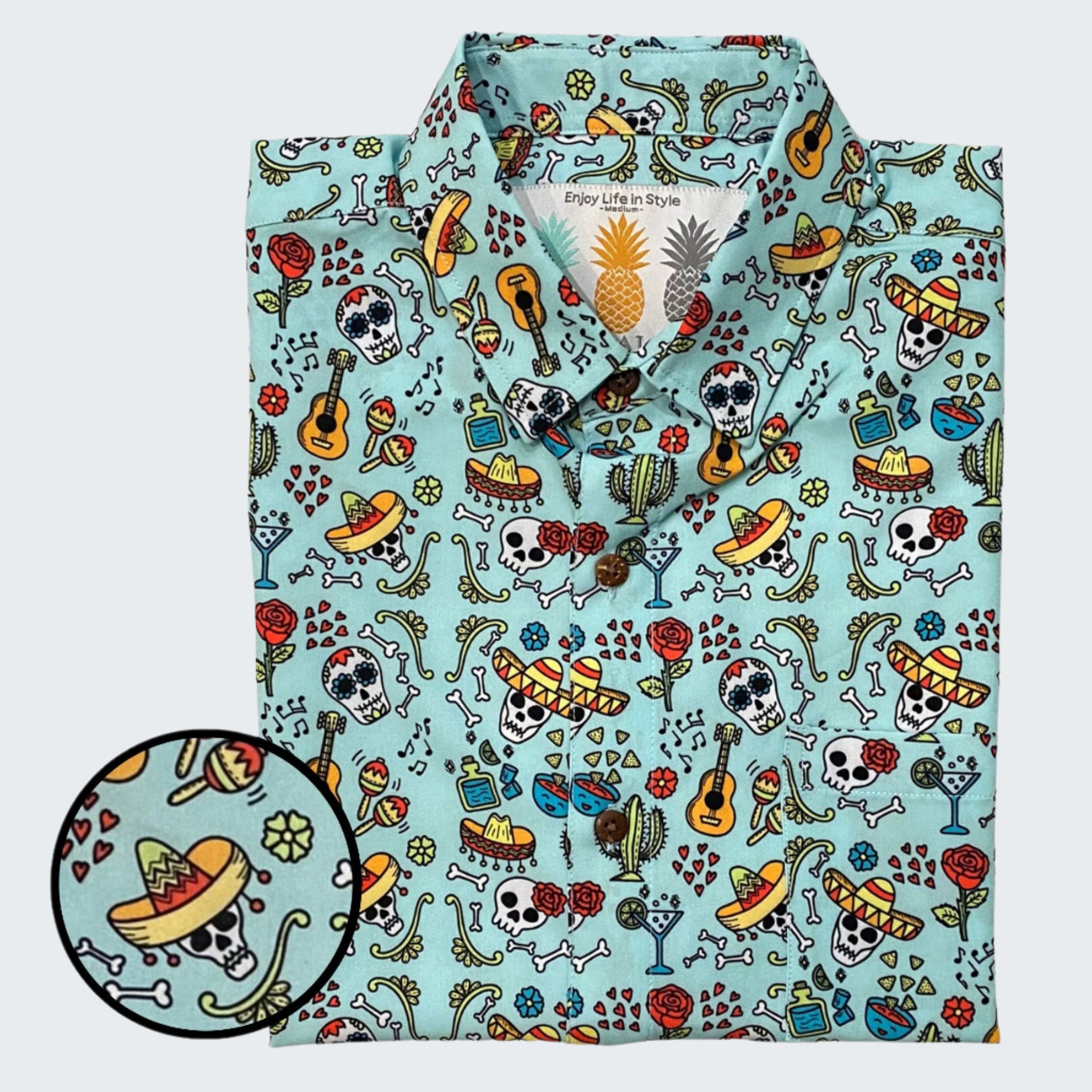 Colorful patterned shirt with skull and guitar design on a light blue background