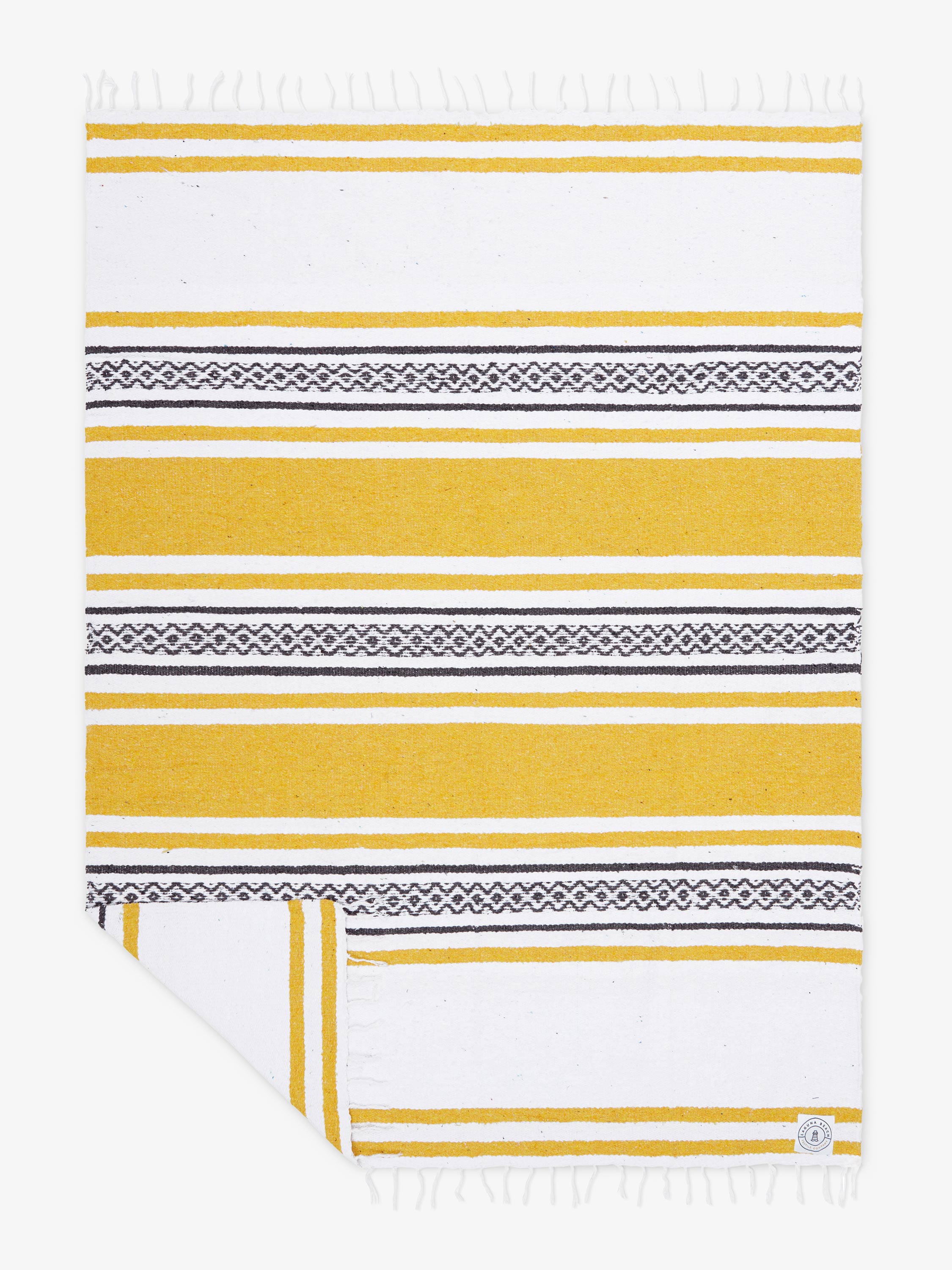 Yellow and white striped towel with geometric patterns on a white background