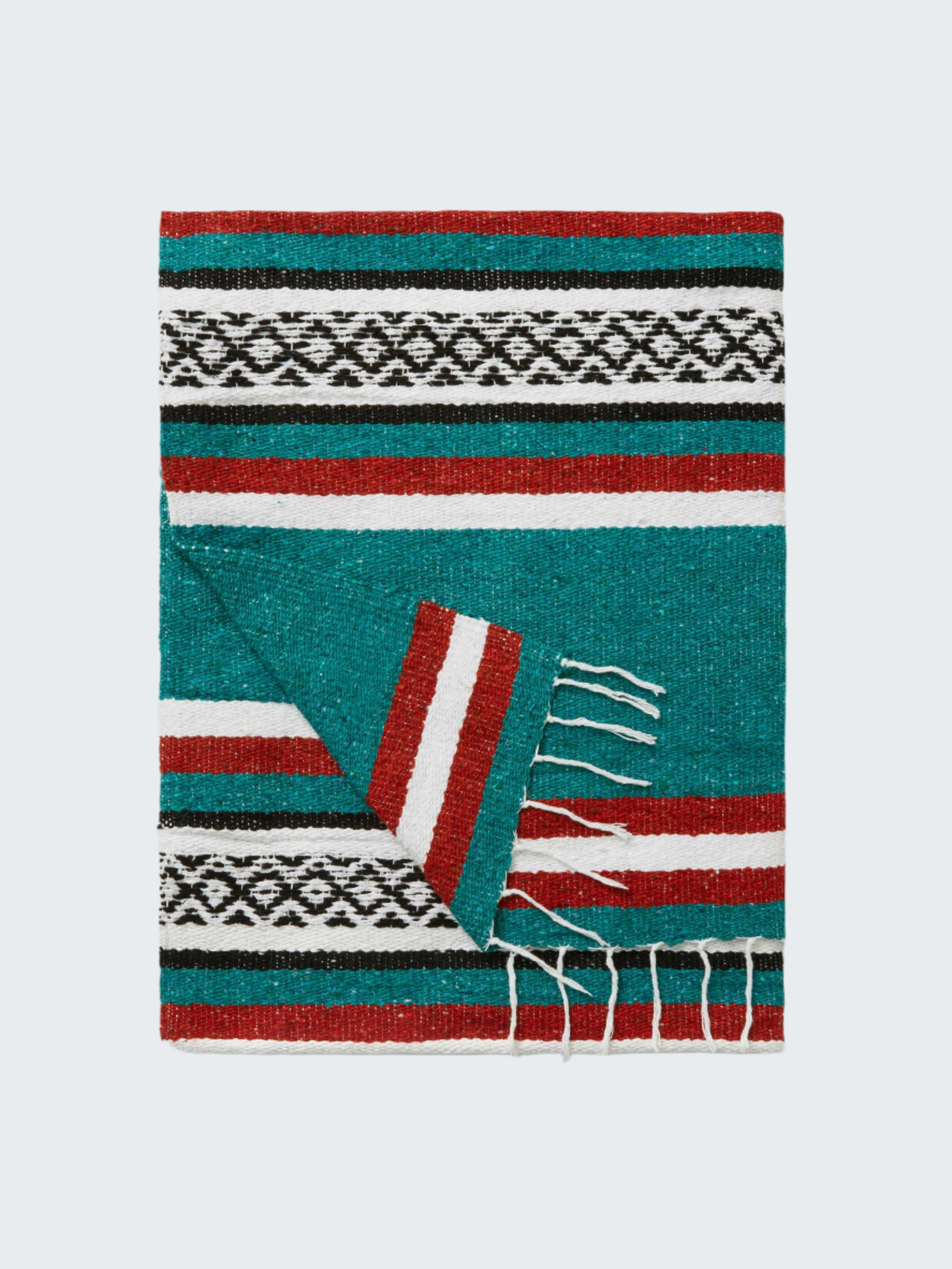Woven blanket with geometric pattern on a white background