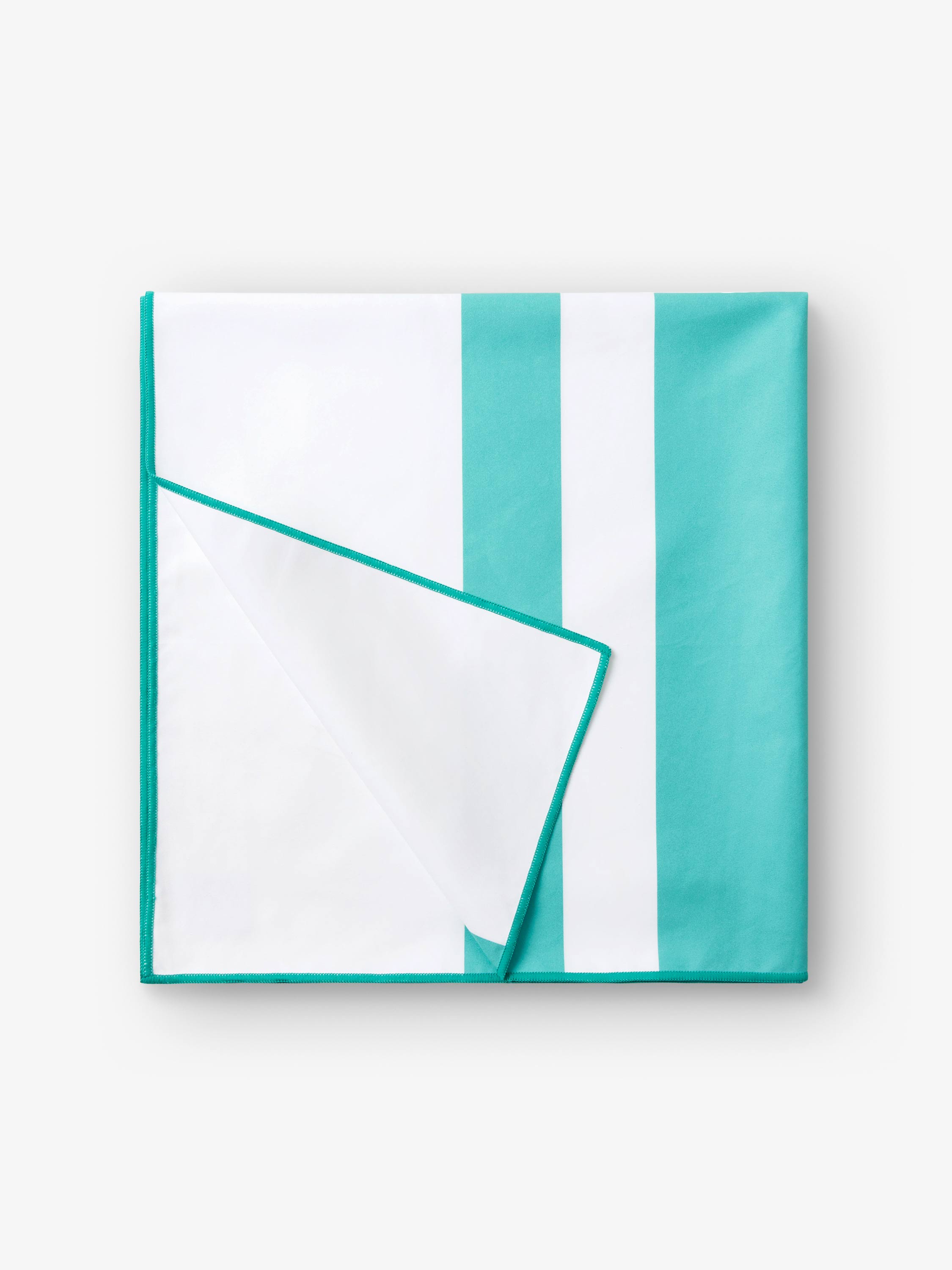 Teal and white striped fabric on a white background
