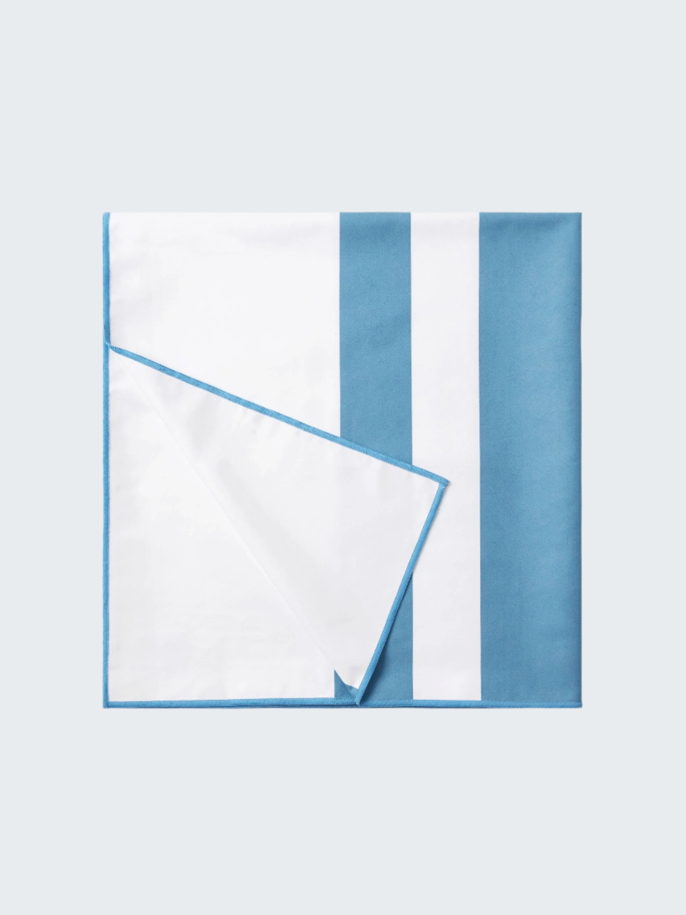 White napkin with blue stripes on a white background