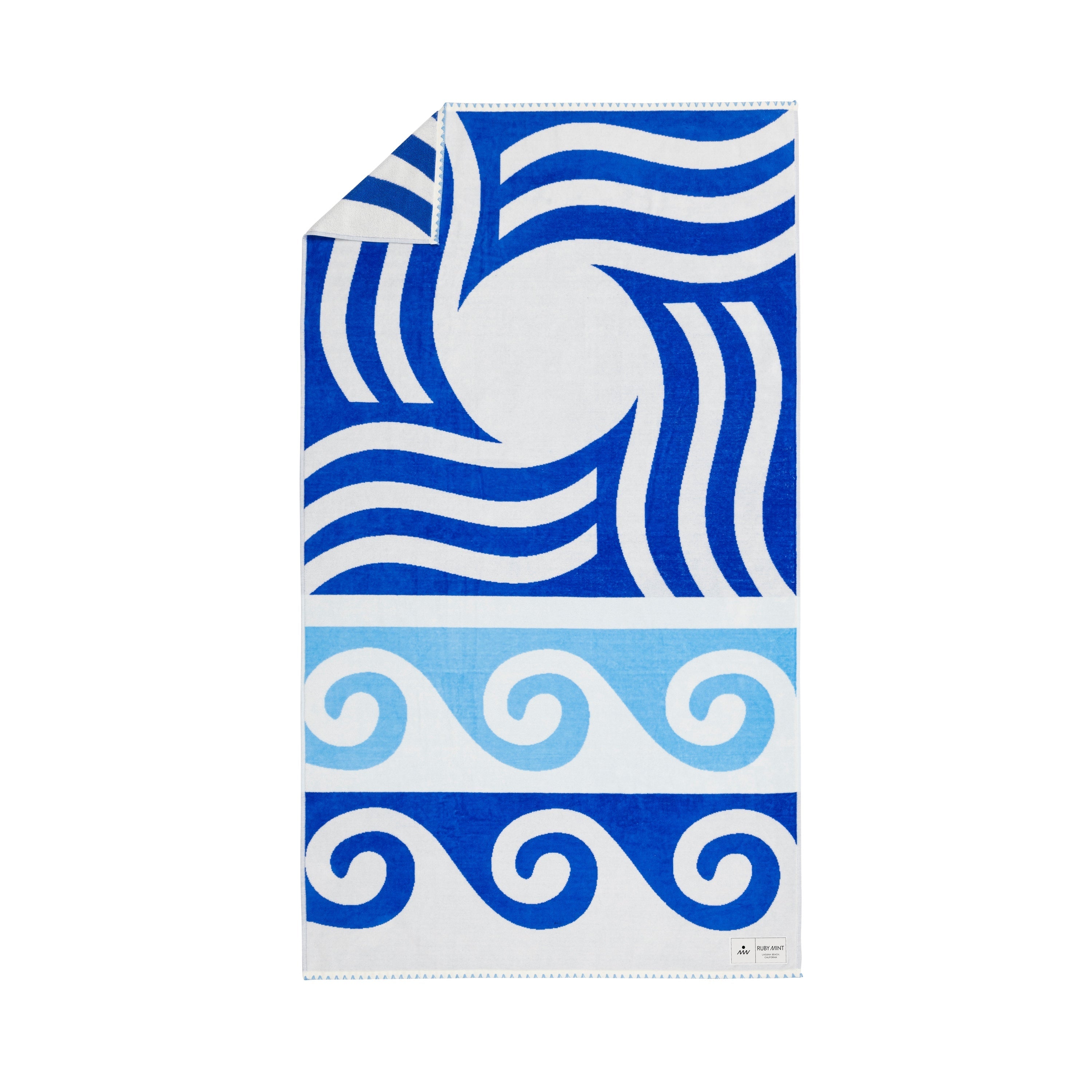 Towel with blue and white wave pattern on a white background