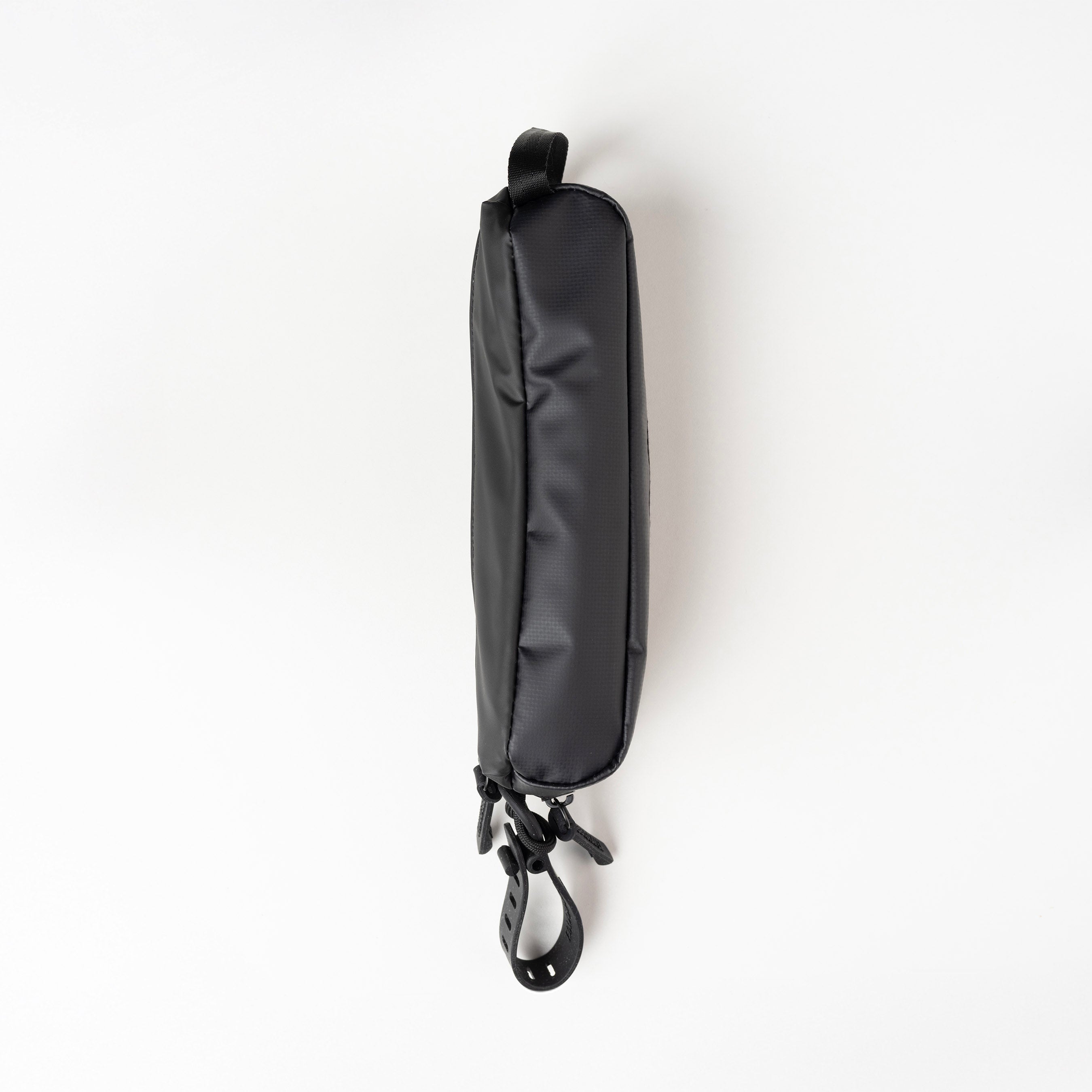 Black strap bag with a clip on a white background