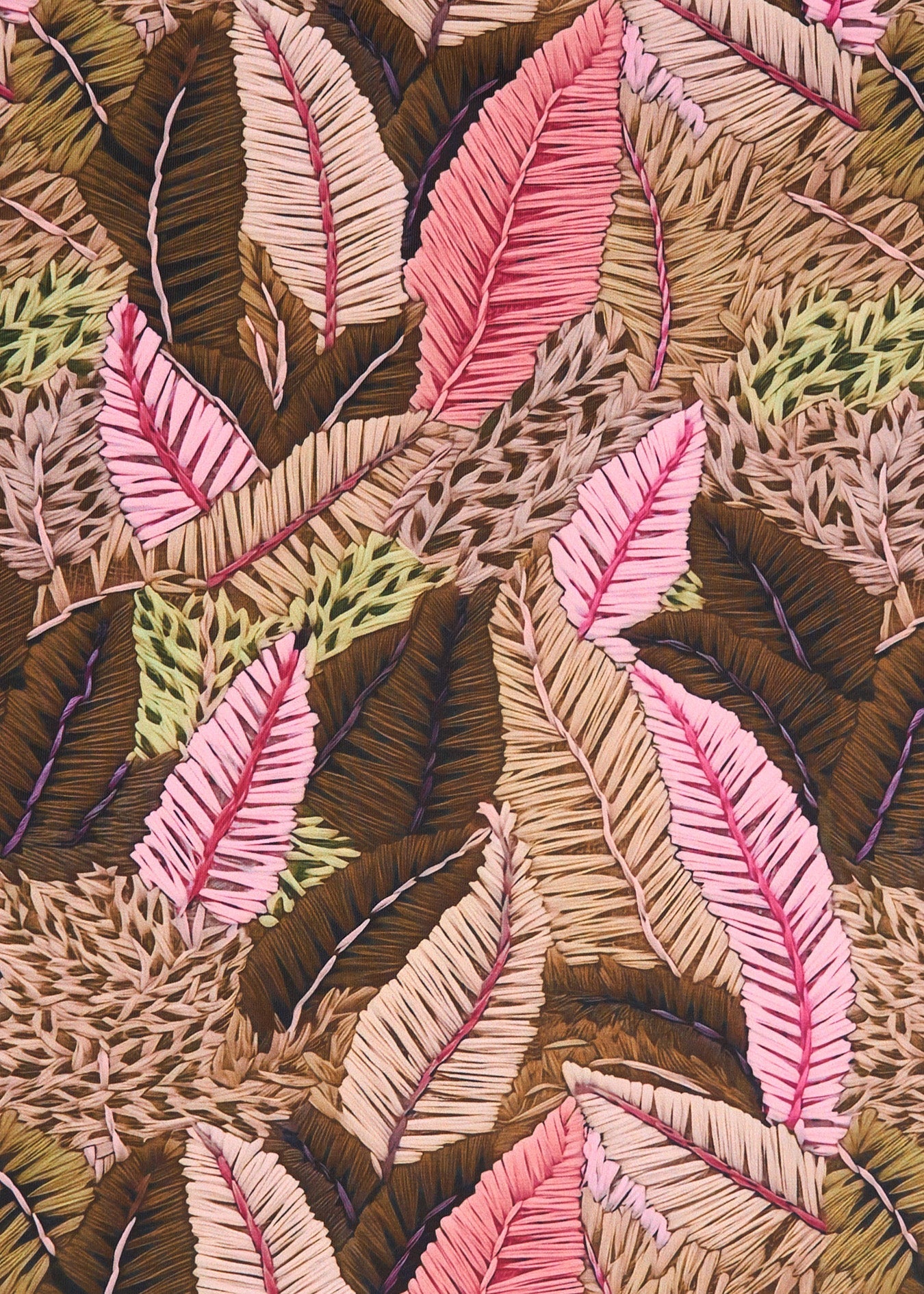 Close-up of embroidered leaf pattern with various colors.