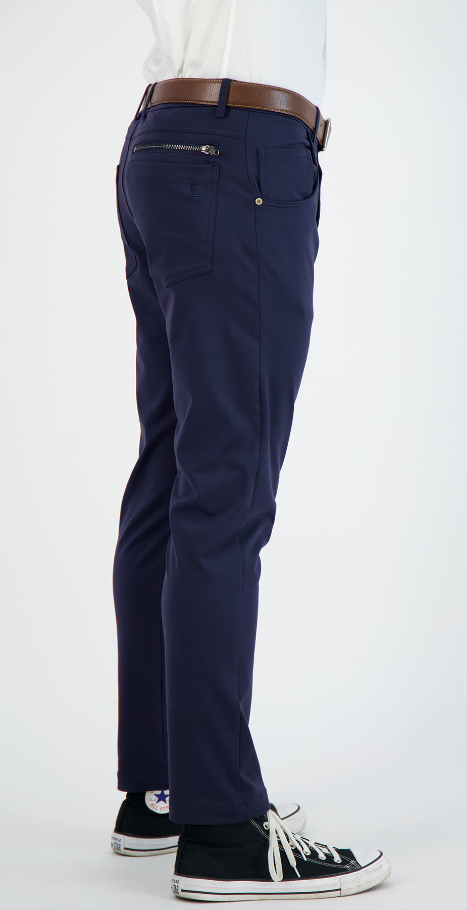 Navy blue pants with a brown belt on a white background