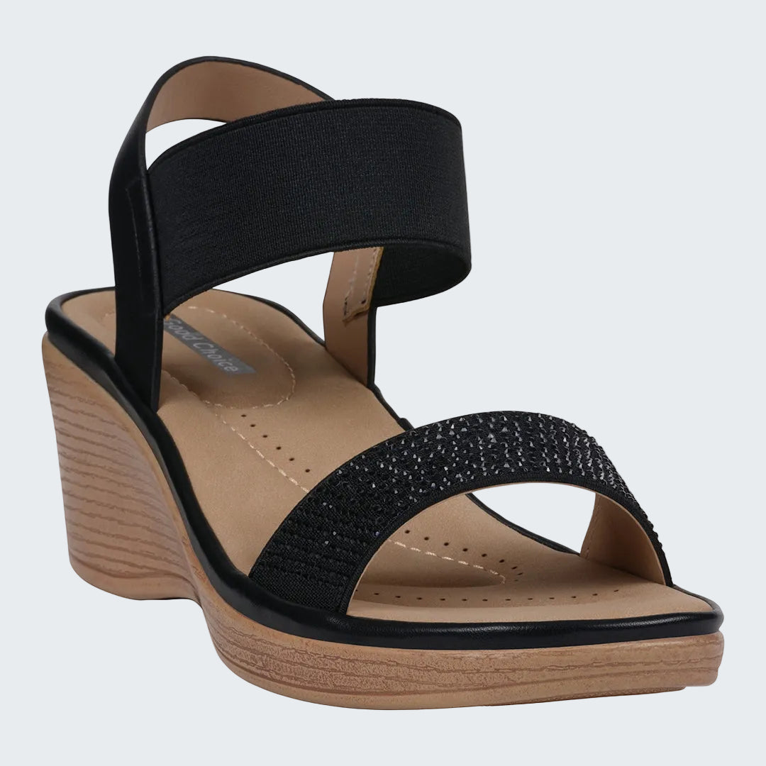 Black wedge sandal with a wooden sole on a white background