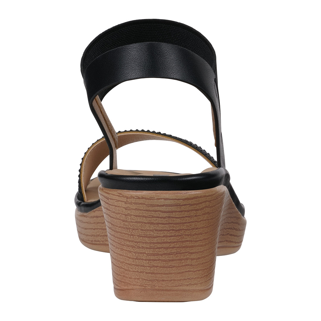 Black sandal with a wooden sole on a white background