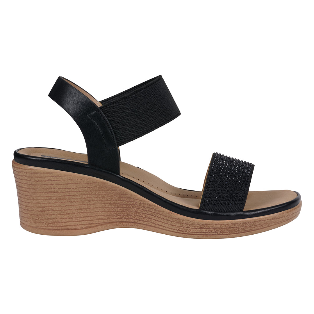 Black wedge sandal with a wooden sole on a white background