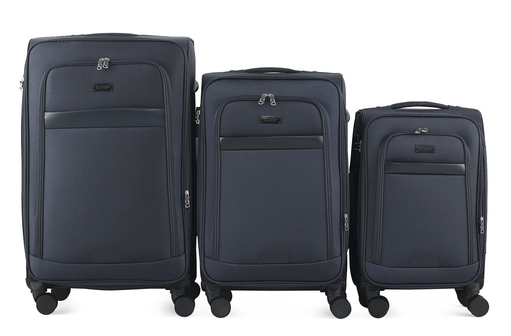 Three blue suitcases of different sizes on a white background