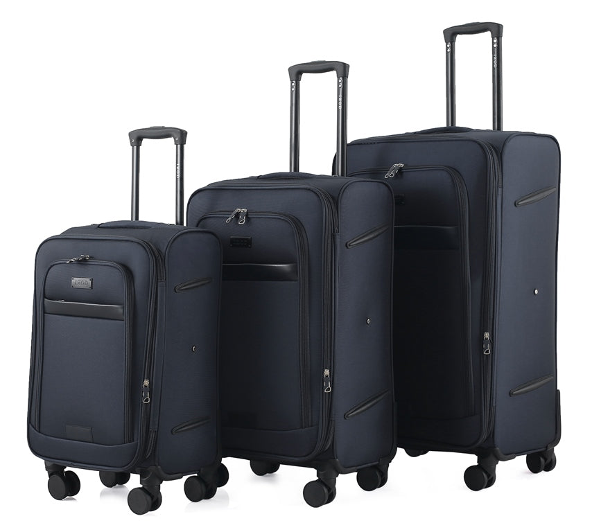Set of three navy blue suitcases of different sizes on a white background