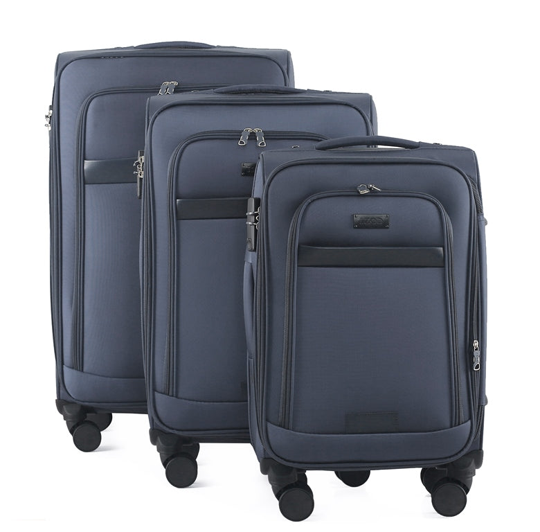 Set of three blue suitcases of different sizes on a white background