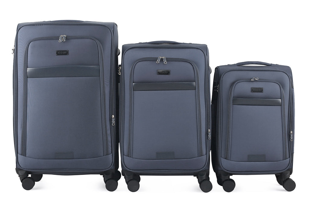 Three blue suitcases of different sizes on a white background