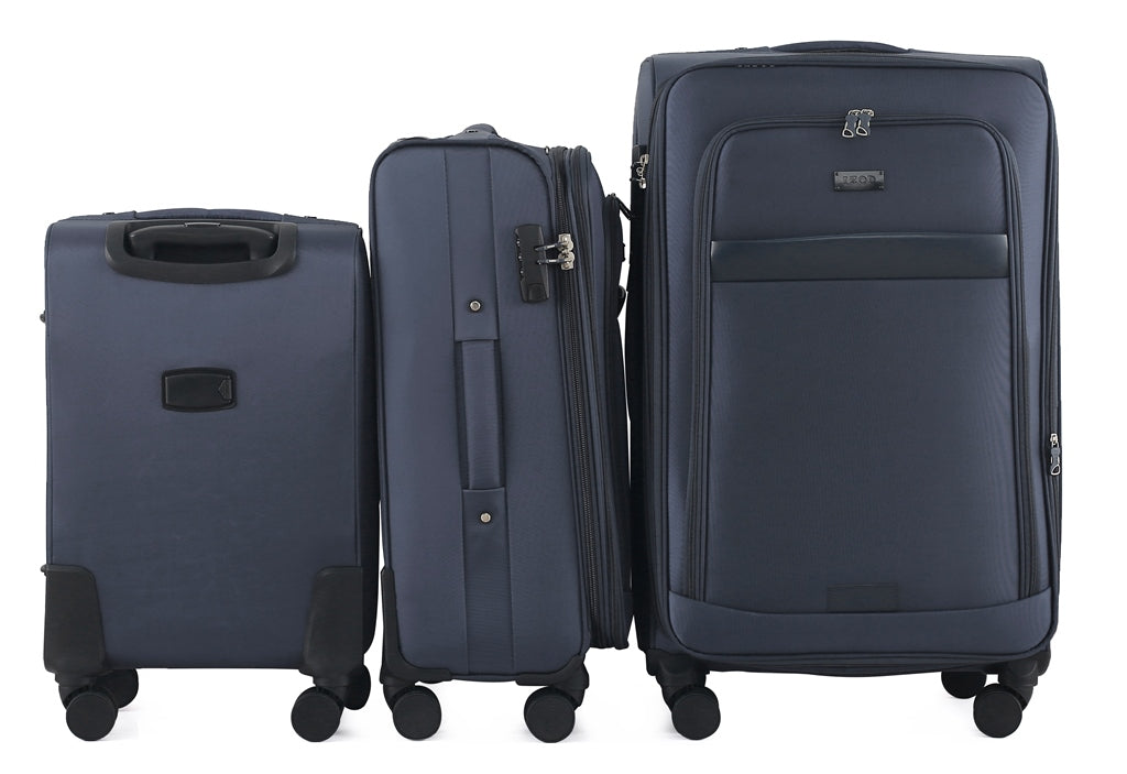 Three navy blue suitcases of different sizes on a white background