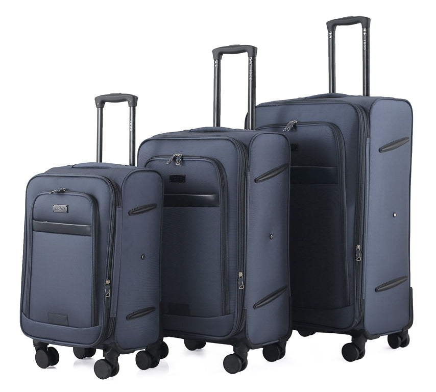 Set of three blue suitcases of different sizes on a white background
