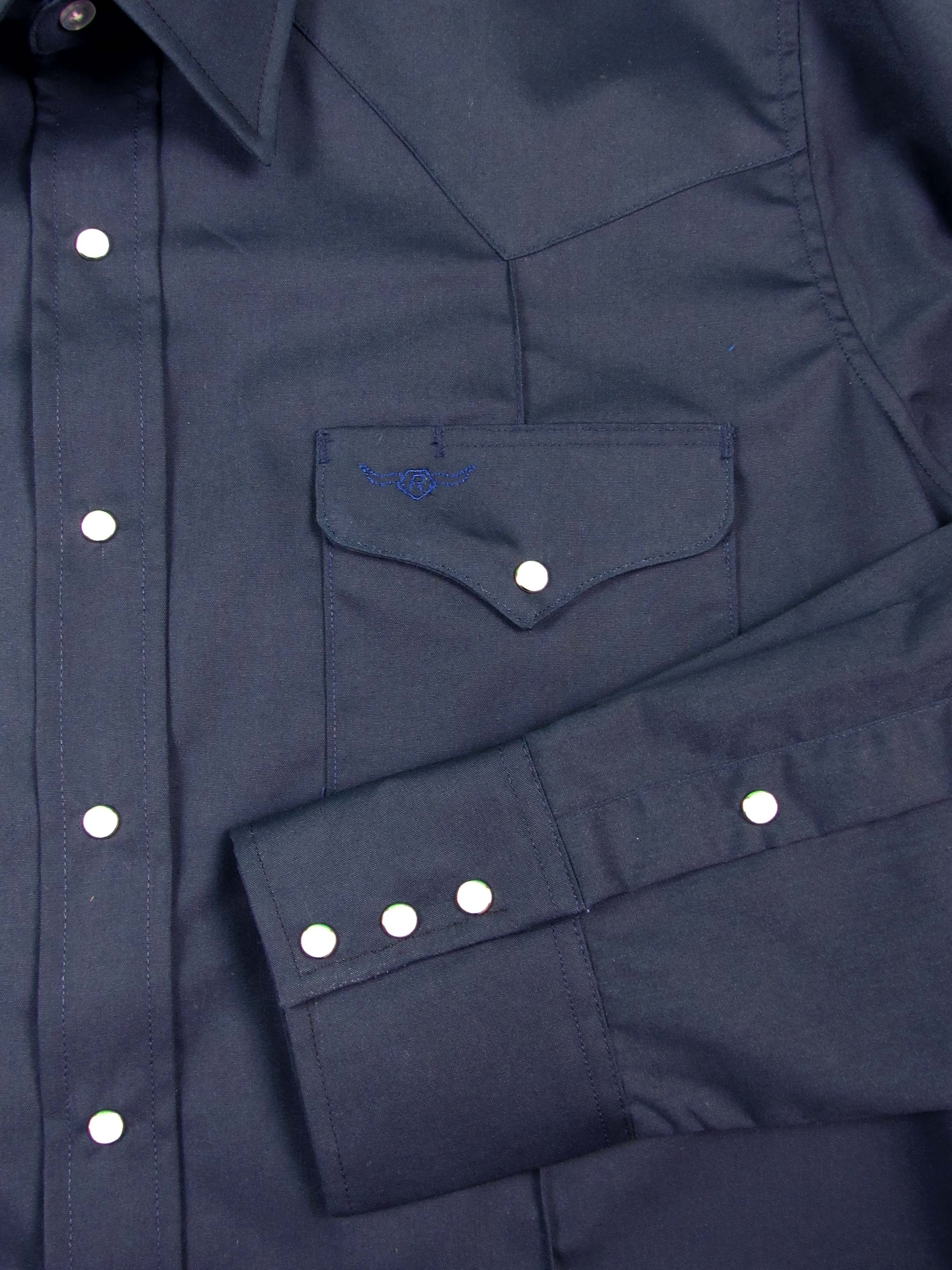 Close-up of a navy blue shirt with button details