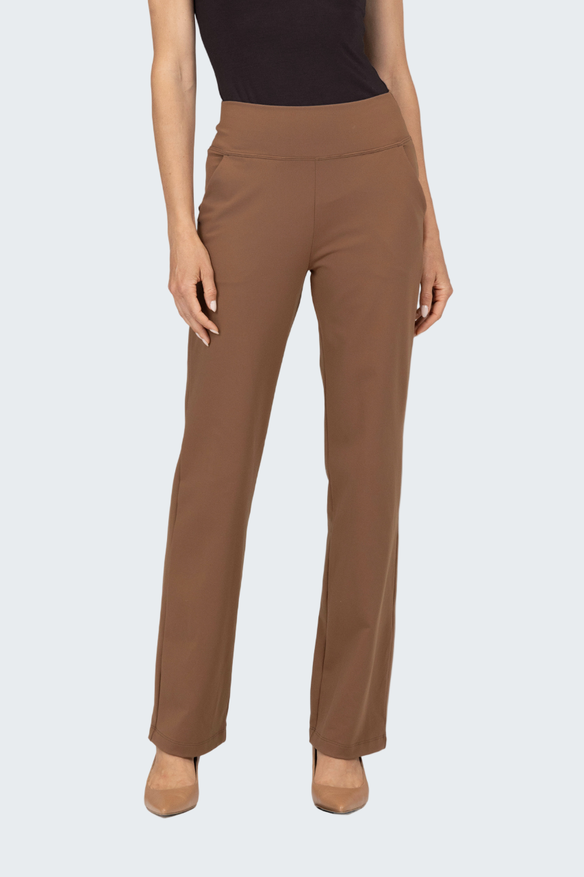 Brown pants worn by a person on a white background