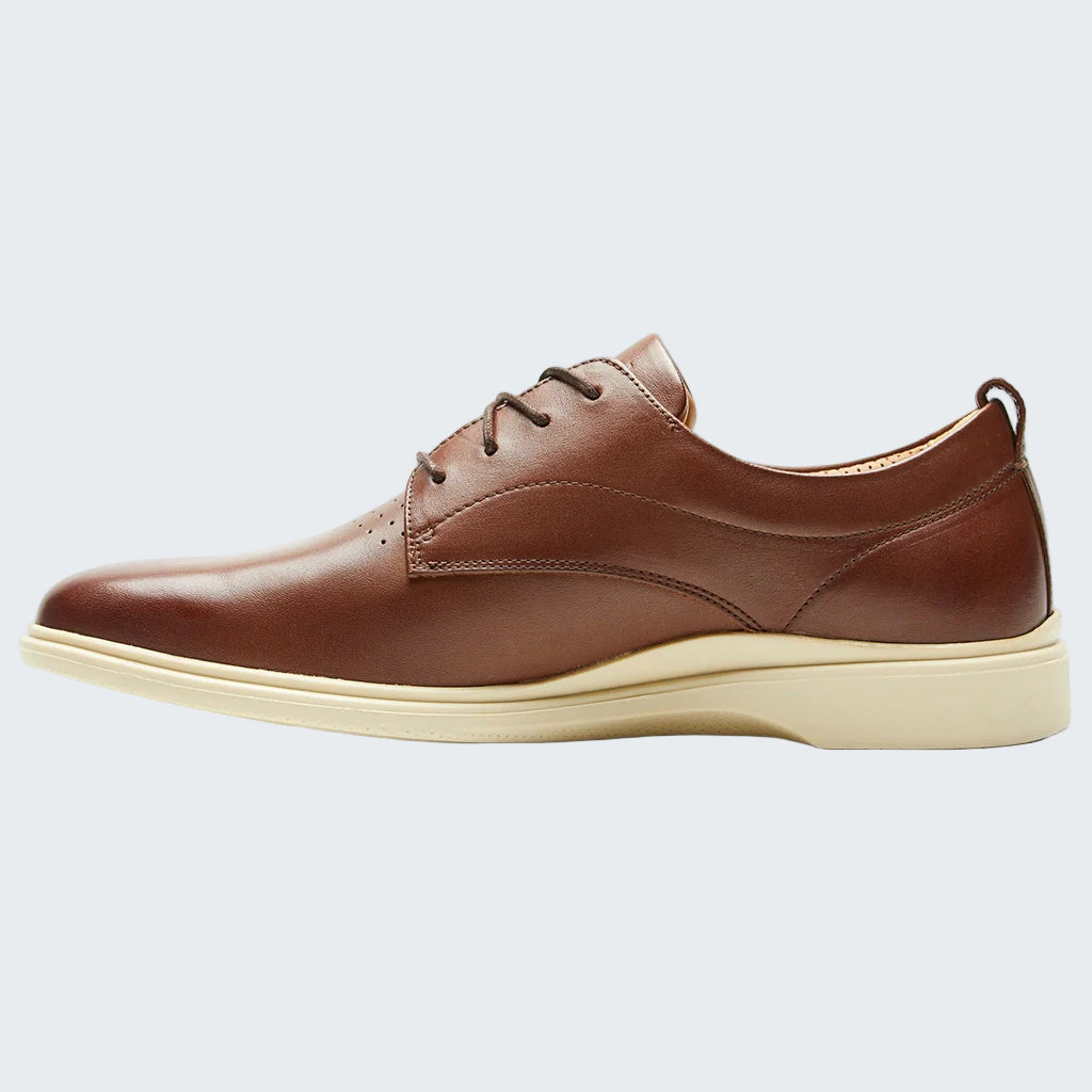 Brown leather shoe on a white background