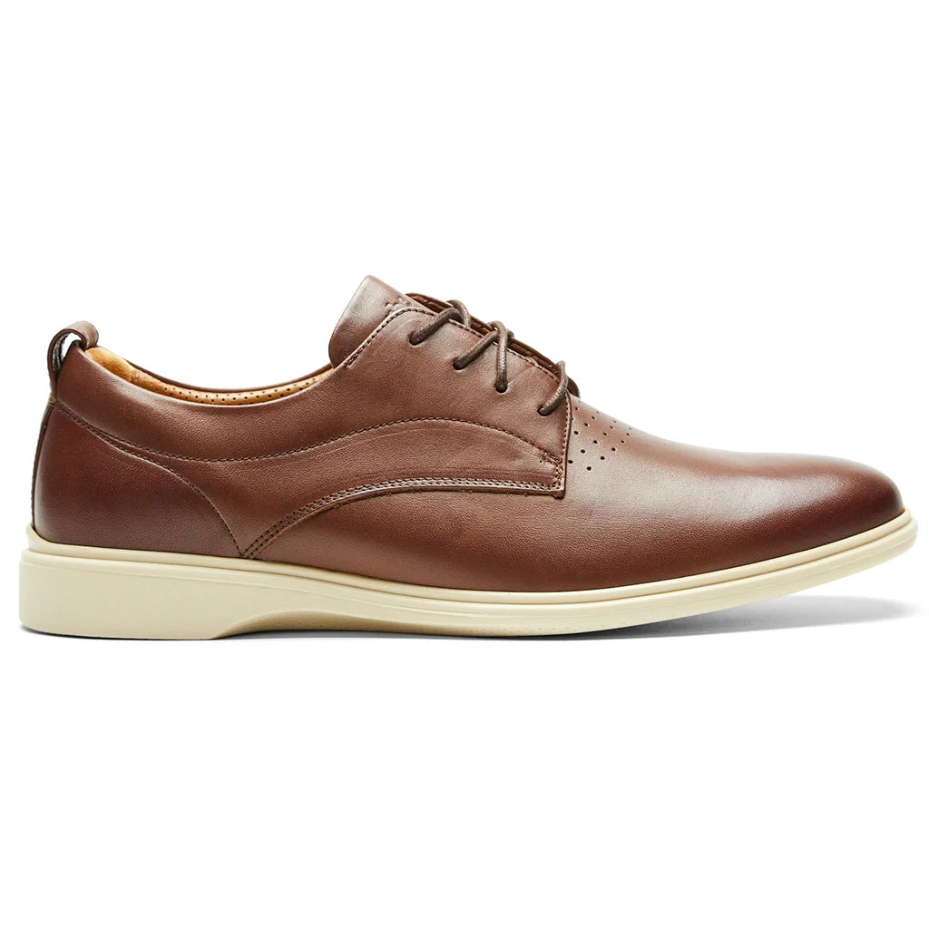 Brown leather shoe on a white background