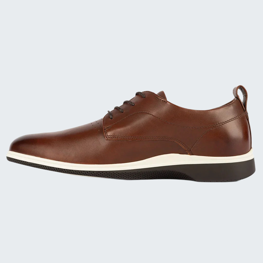 Brown leather shoe with a white sole on a white background
