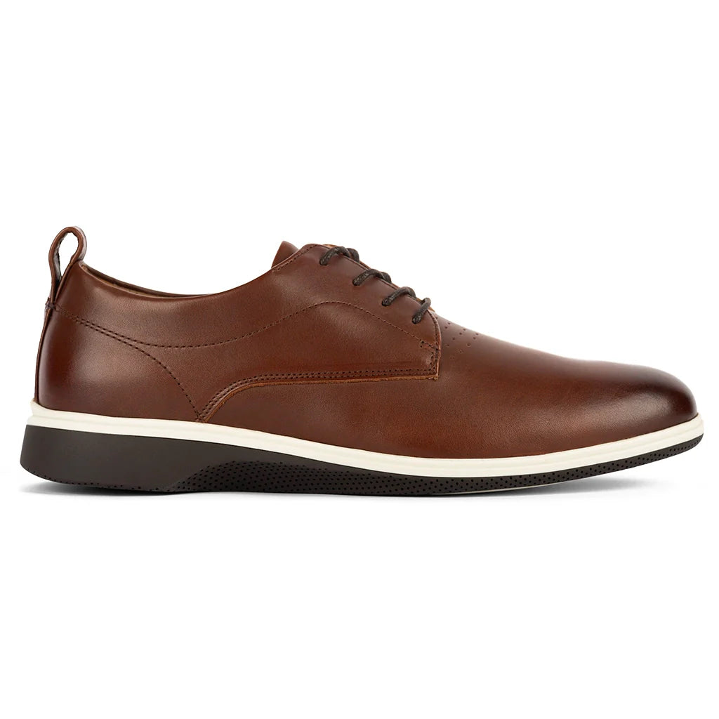 Brown leather shoe with a white sole on a white background